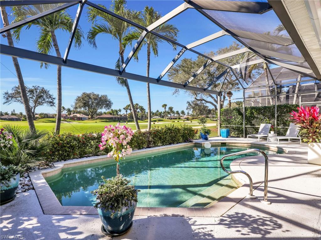 4304 Kensington High Street Naples, FL 34105 - Photo 29 of 40 a view of a chair and tables in the garden