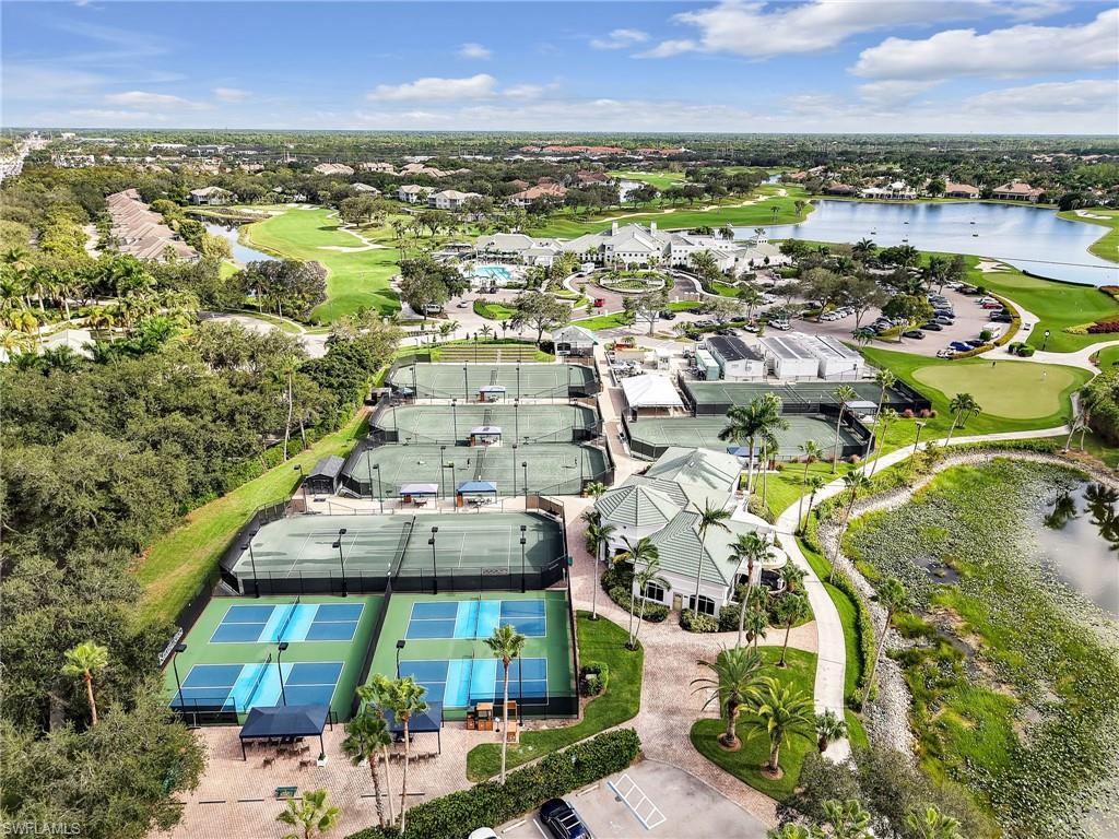 4304 Kensington High Street Naples, FL 34105 - Photo 35 of 40 an aerial view of residential building and lake