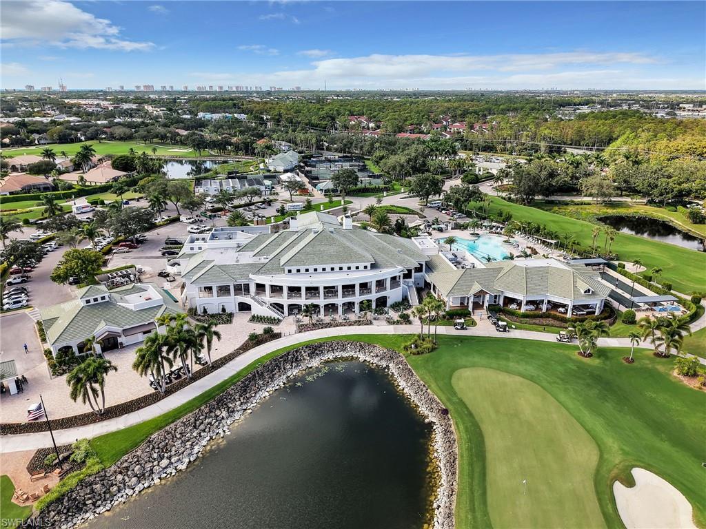 4304 Kensington High Street Naples, FL 34105 - Photo 39 of 40 an aerial view of a city with lots of residential buildings ocean and mountain view in back