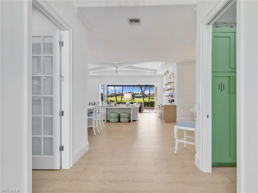4304 Kensington High Street Naples, FL 34105 - Photo 4 of 40 a living room with furniture and a fireplace