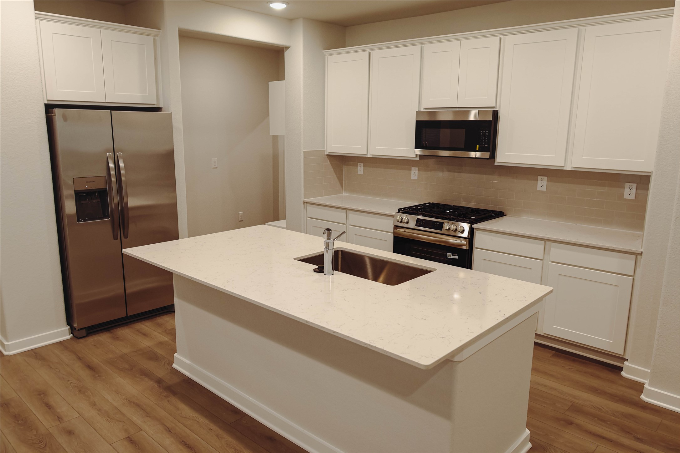 16 Courageous Way Magnolia, TX 77354 - Photo 6 of 19 a kitchen with a appliances a sink and a microwave
