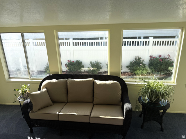 77 West Alta View Way Sandy, UT 84070 - Photo 9 of 43 Sunroom featuring multiple windows overlooking landscaping
