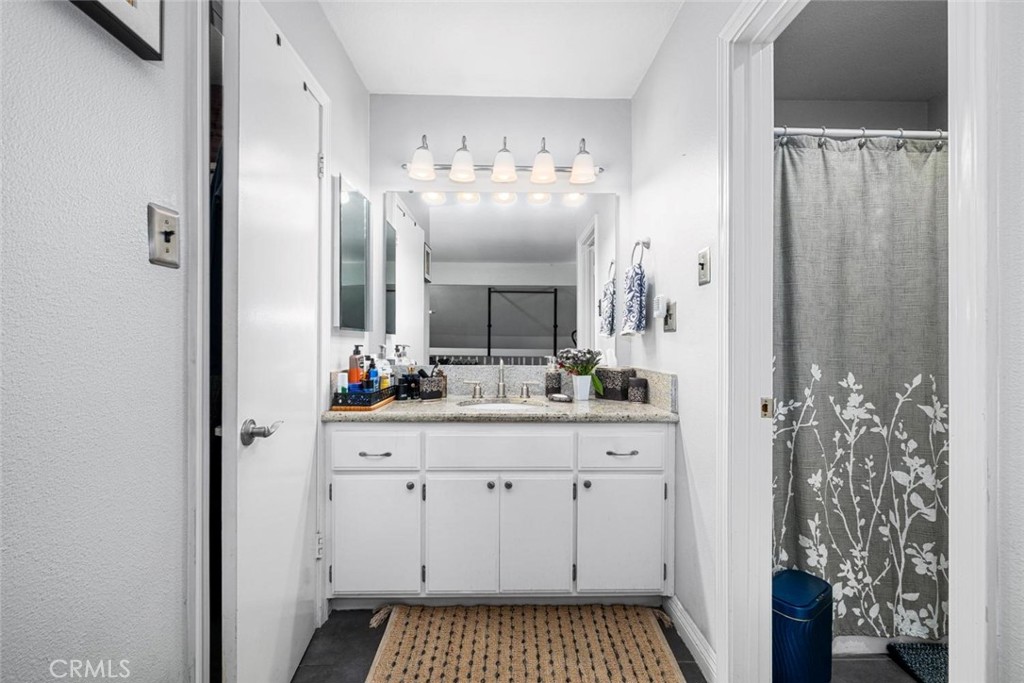 7890 East Spring Street, Unit 15D Long Beach, CA 90815 - Photo 19 of 40 Vaniety between closet and bathroom
