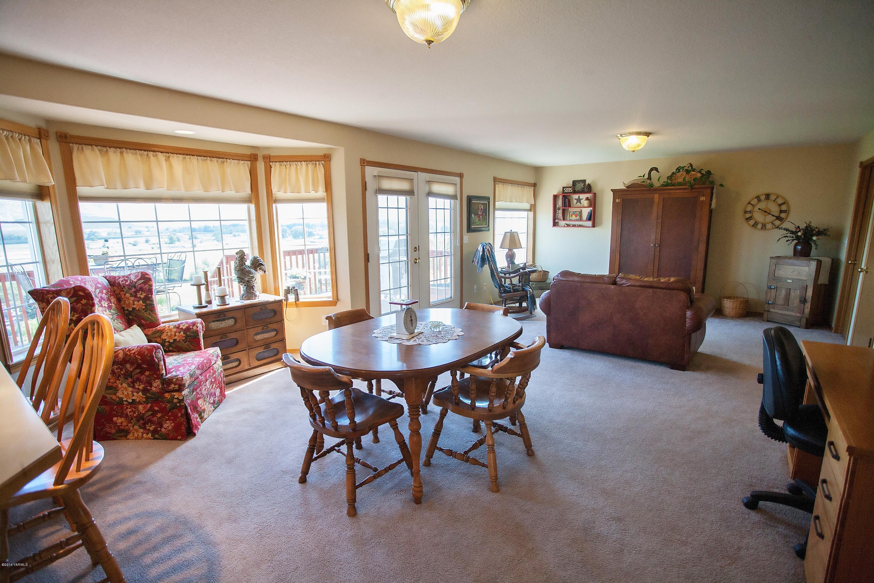 16353 Ahtanum Road Yakima, WA 98903 - Photo 14 of 46 a view of a dining room with furniture and a window