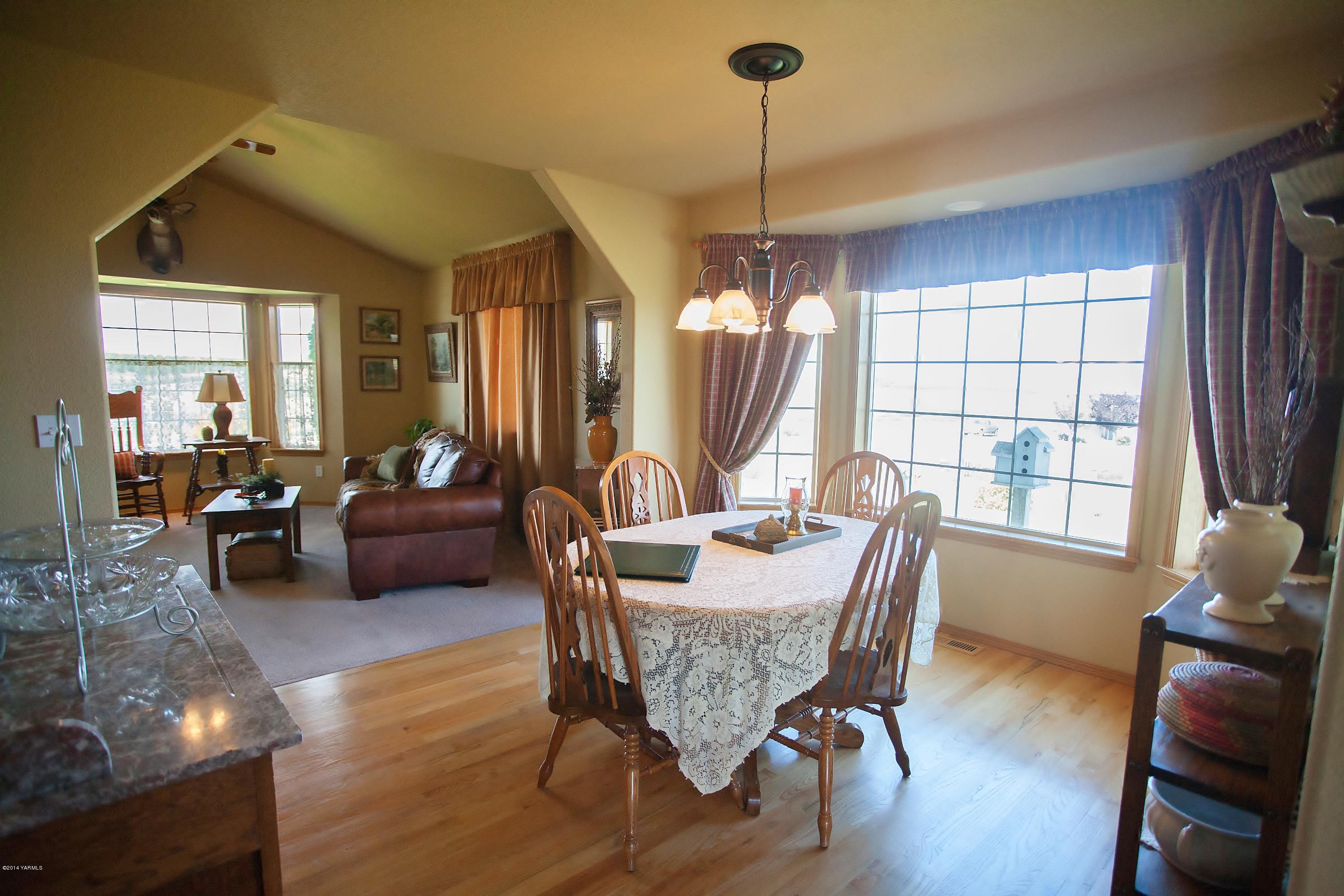 16353 Ahtanum Road Yakima, WA 98903 - Photo 8 of 46 a view of a livingroom with furniture window and wooden floor