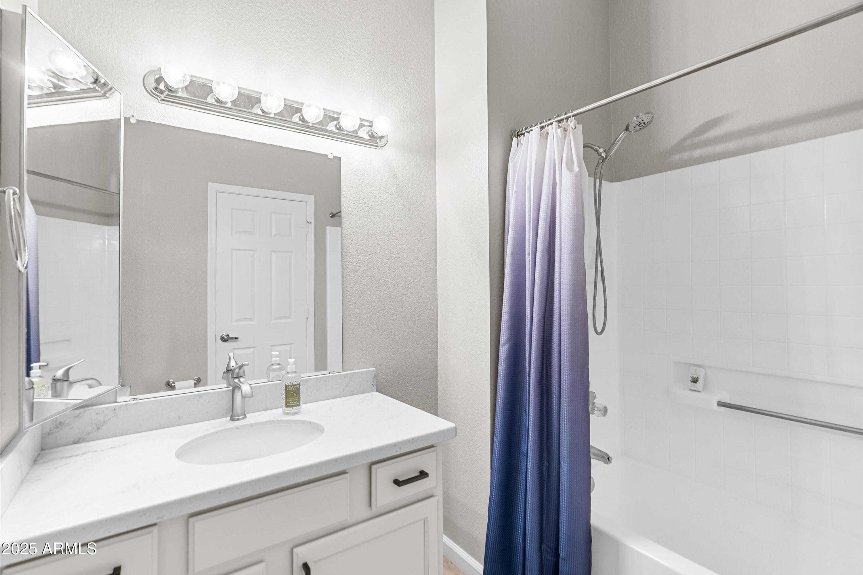 1331 West Baseline Road, Unit 338 Mesa, AZ 85202 - Photo 12 of 28 a bathroom with a sink and a mirror