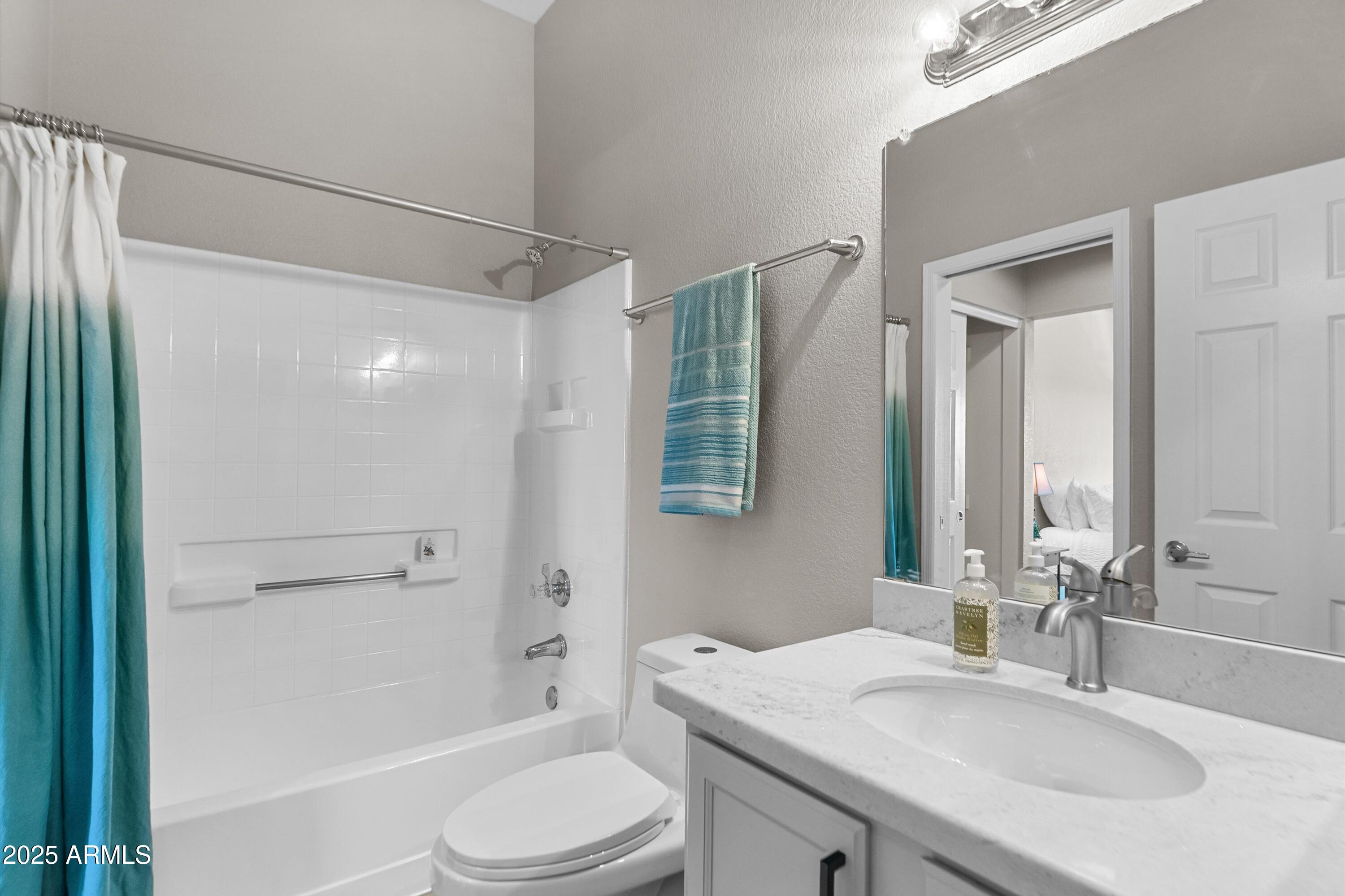 1331 West Baseline Road, Unit 338 Mesa, AZ 85202 - Photo 15 of 28 a bathroom with a sink toilet and shower