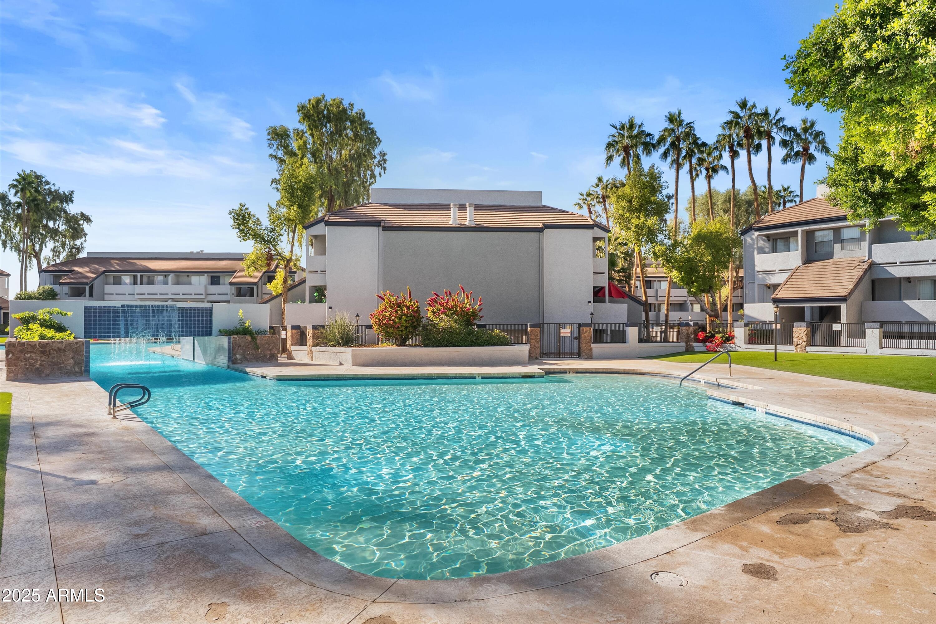 1331 West Baseline Road, Unit 338 Mesa, AZ 85202 - Photo 19 of 28 a view of a swimming pool with a patio