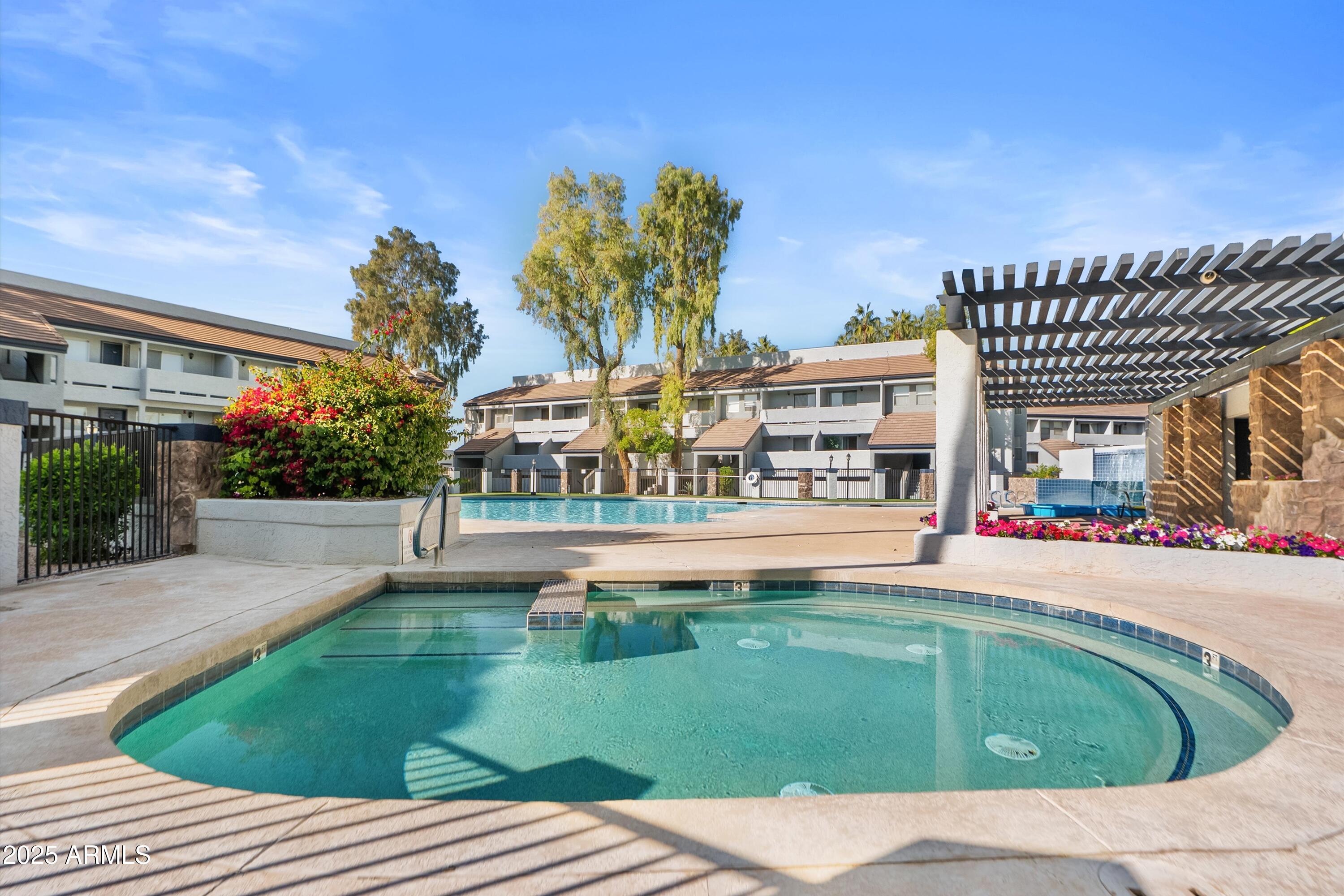 1331 West Baseline Road, Unit 338 Mesa, AZ 85202 - Photo 20 of 28 a swimming pool with outdoor seating and yard