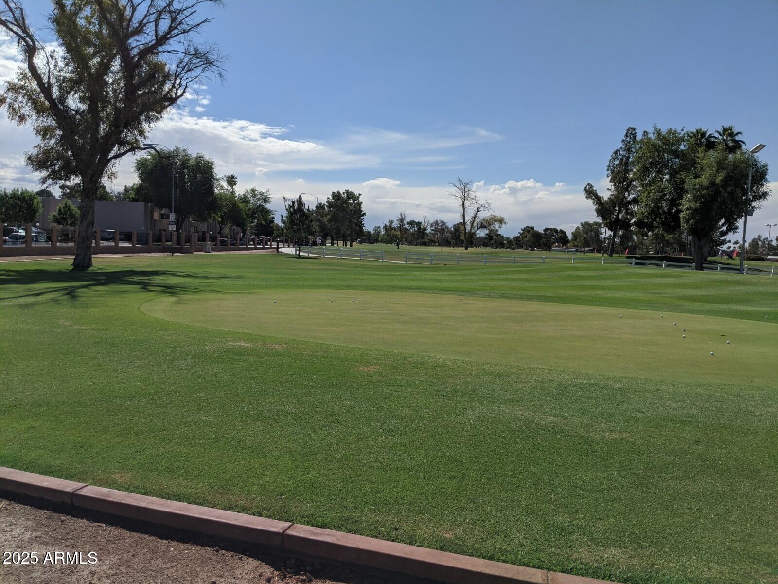1331 West Baseline Road, Unit 338 Mesa, AZ 85202 - Photo 28 of 28 a view of a golf course with a lake