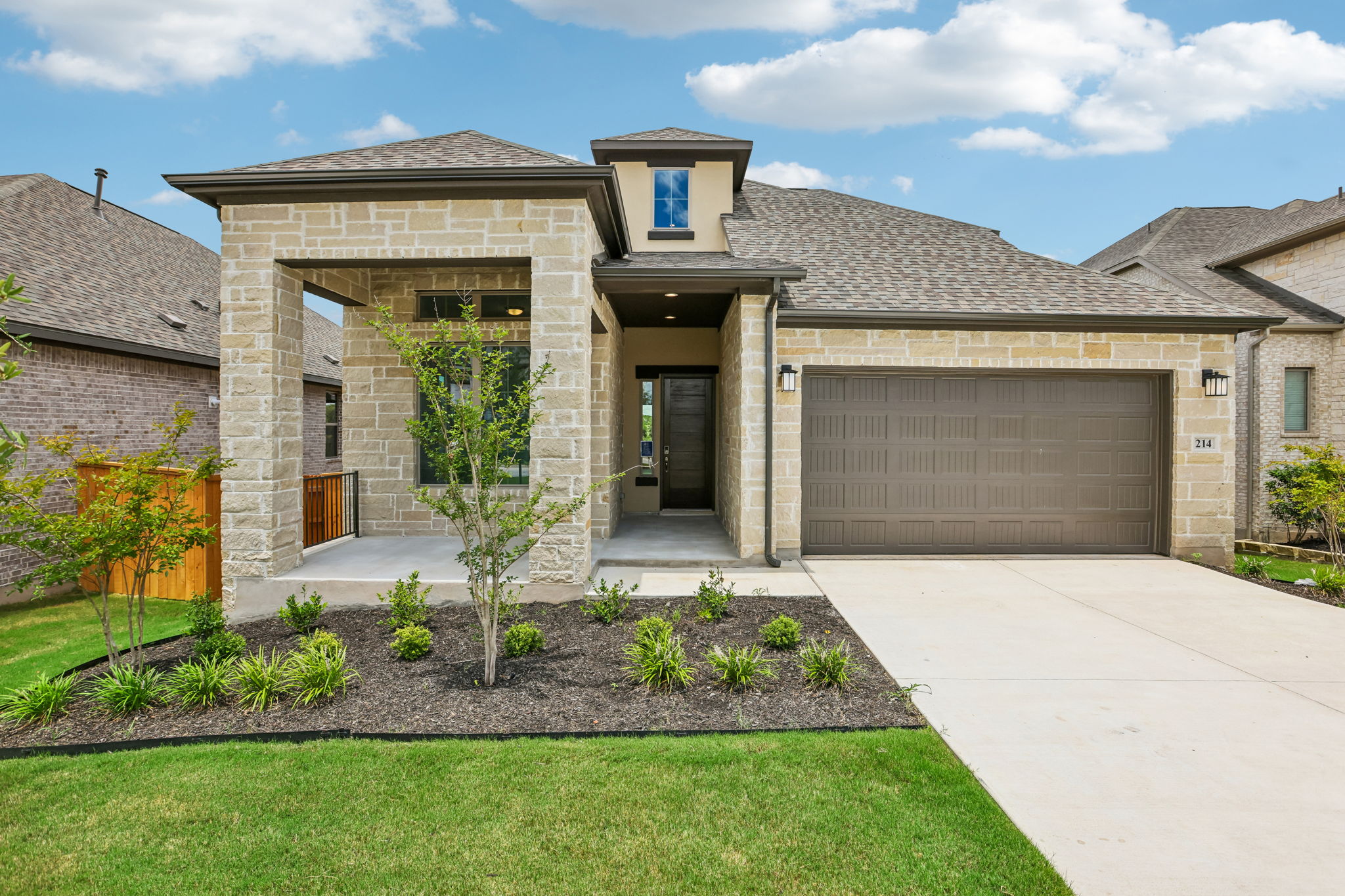 214 Prickly Poppy Loop Kyle, TX 78640 - Photo 1 of 38 a front view of a house with garden
