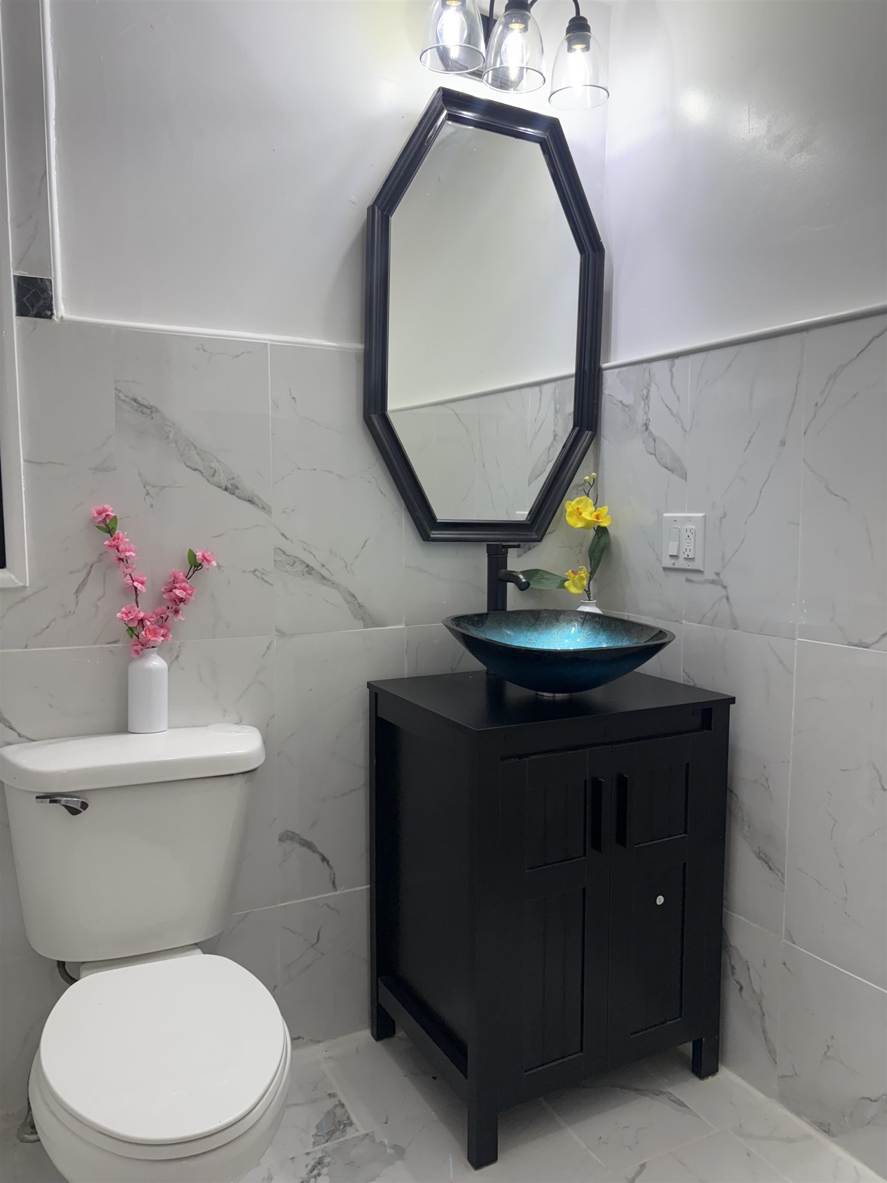 77 Crescent Avenue, Unit 5 Jersey City, NJ 07304 - Photo 15 of 18 a bathroom with a toilet a sink and mirror