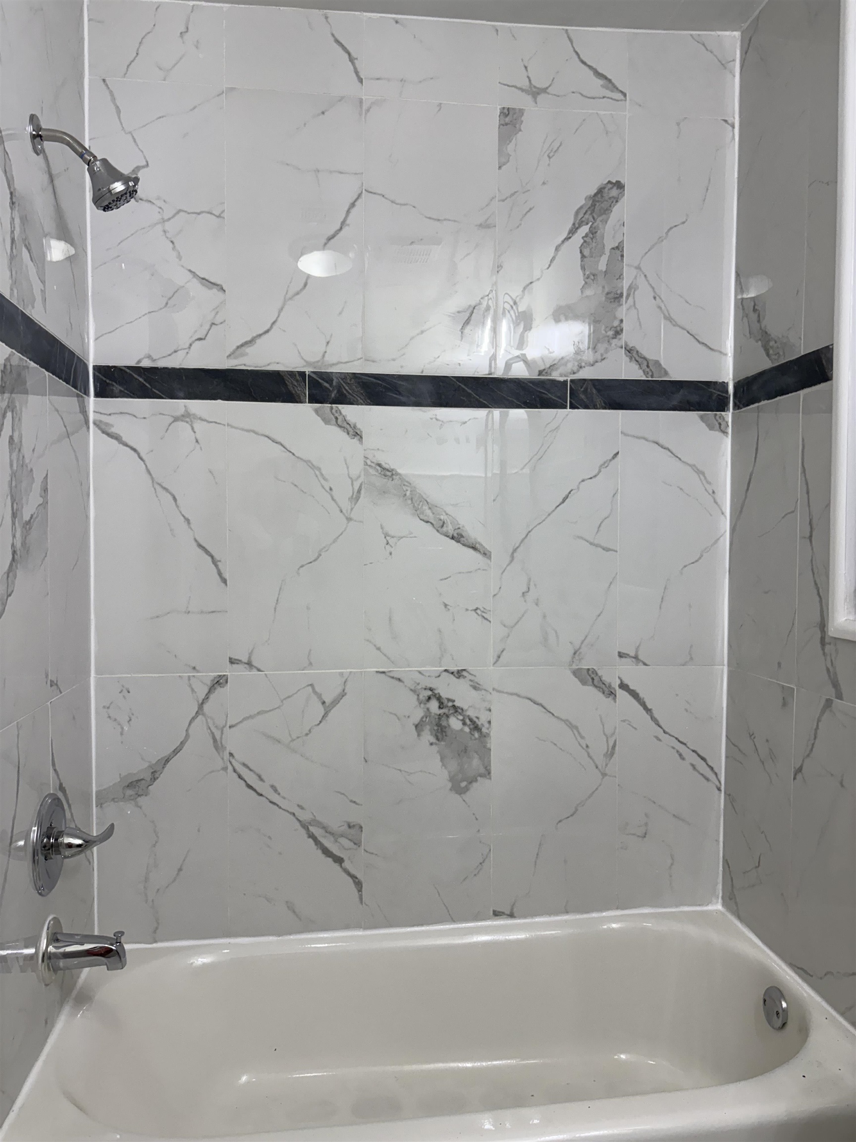 77 Crescent Avenue, Unit 5 Jersey City, NJ 07304 - Photo 16 of 18 a bathroom with a bathtub