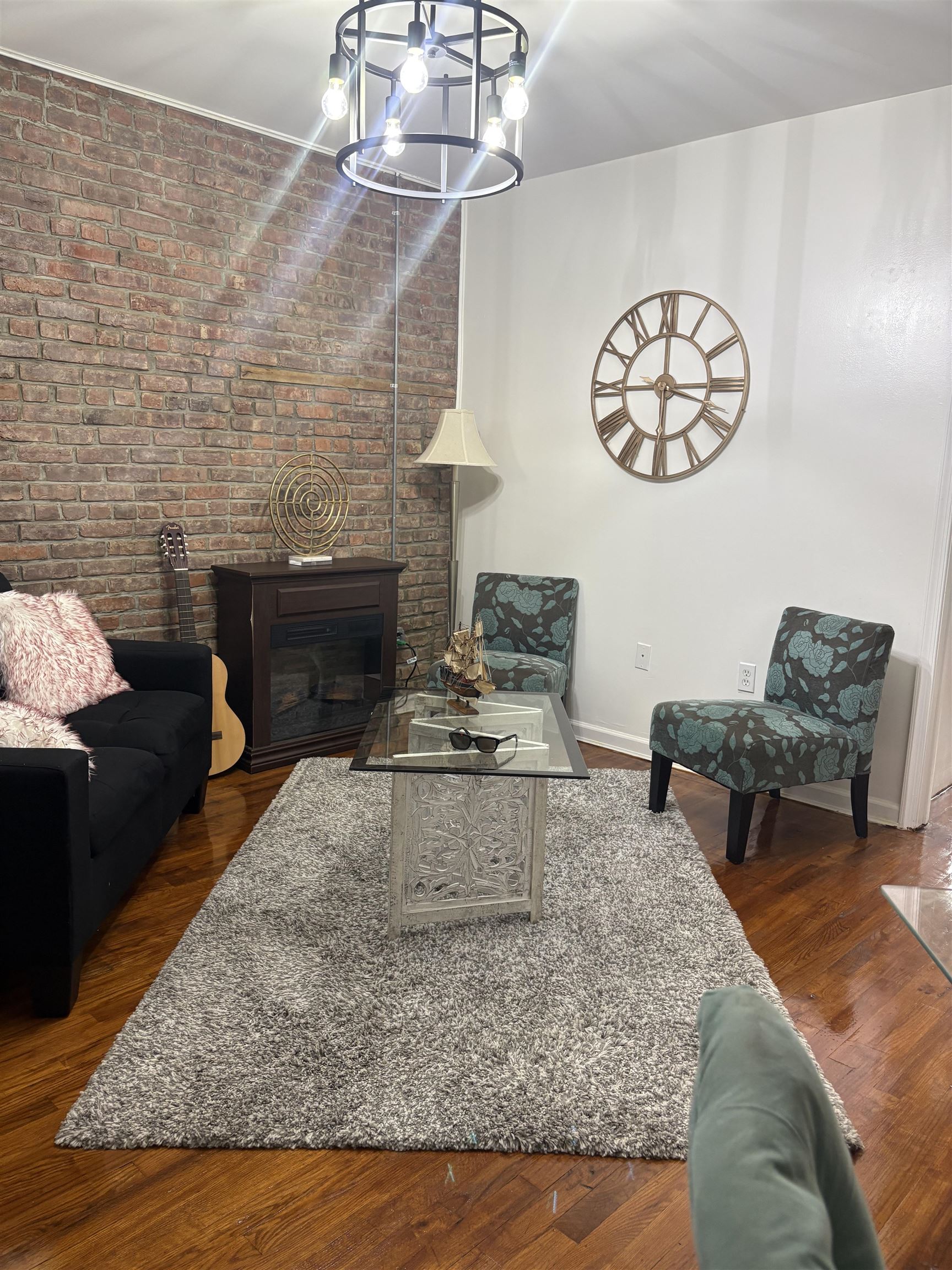 77 Crescent Avenue, Unit 5 Jersey City, NJ 07304 - Photo 3 of 18 a living room with furniture and a fireplace