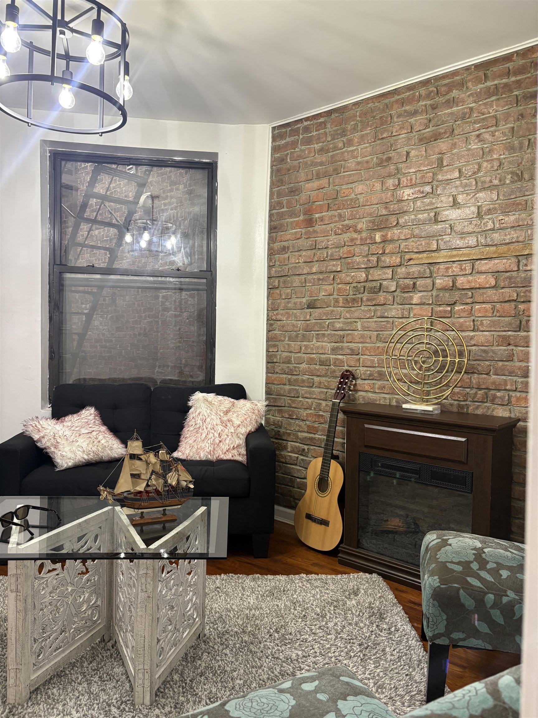 77 Crescent Avenue, Unit 5 Jersey City, NJ 07304 - Photo 4 of 18 a living room with furniture