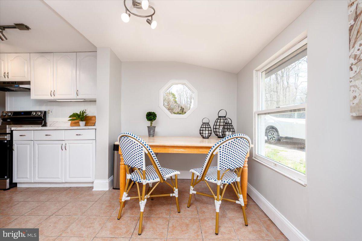 626 Clark Avenue Deale, MD 20751 - Photo 13 of 74 a dining room with furniture and window