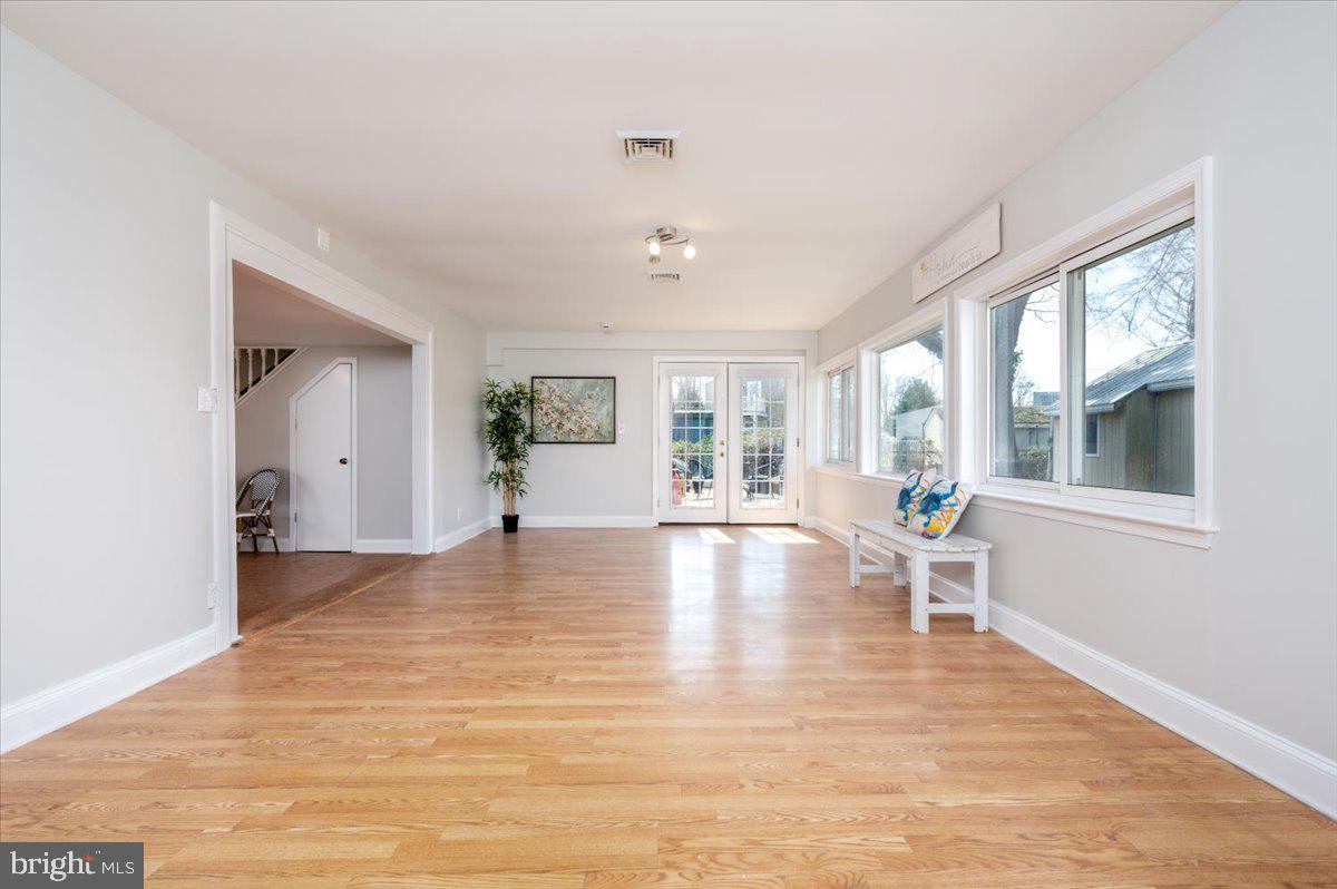 626 Clark Avenue Deale, MD 20751 - Photo 14 of 74 a view of an empty room with wooden floor and a window