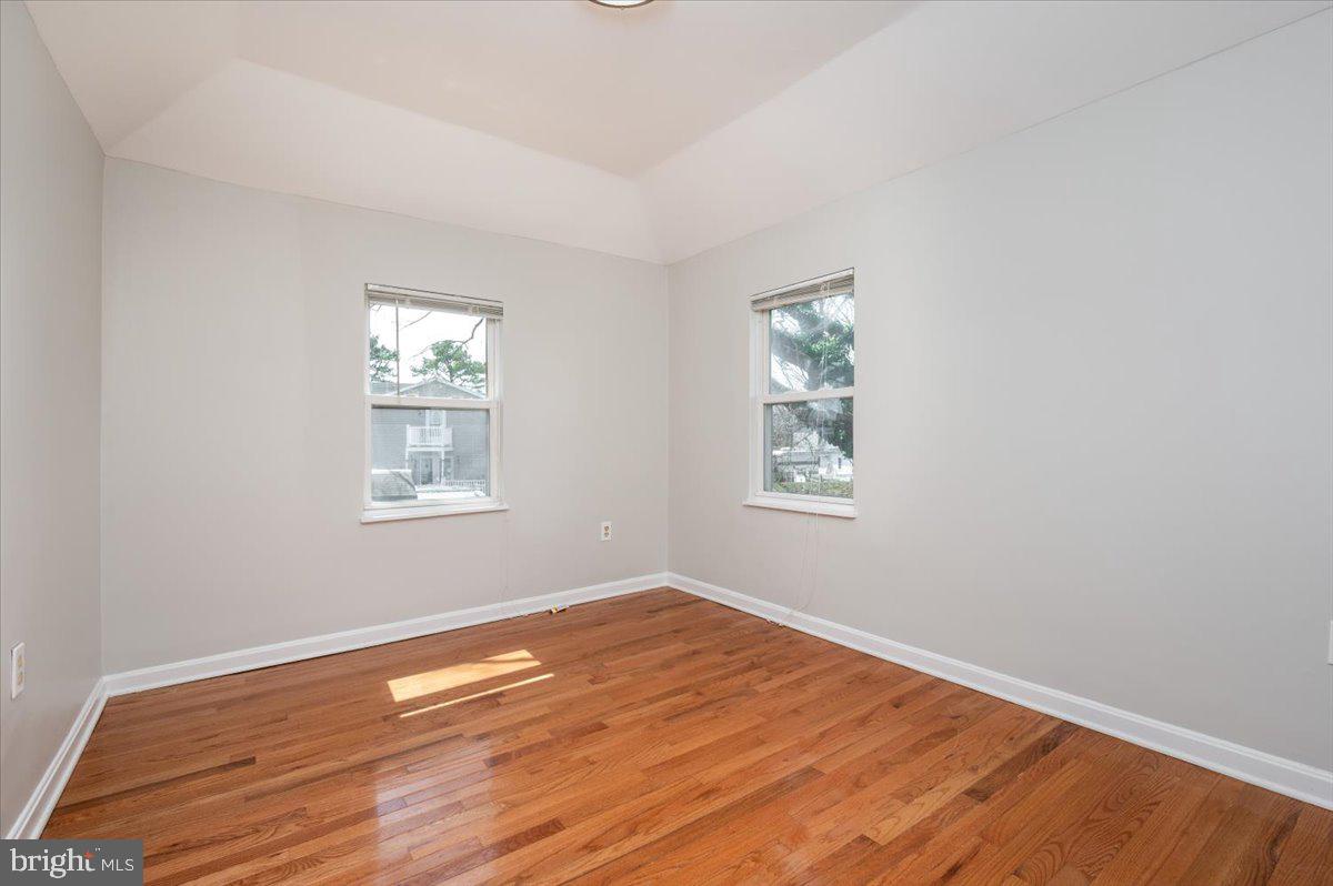 626 Clark Avenue Deale, MD 20751 - Photo 18 of 74 an empty room with wooden floor and windows