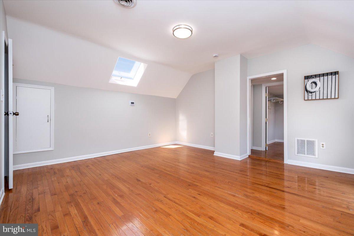 626 Clark Avenue Deale, MD 20751 - Photo 24 of 74 an empty room with wooden floor and windows
