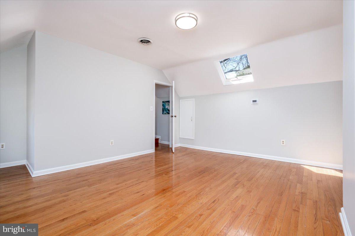 626 Clark Avenue Deale, MD 20751 - Photo 25 of 74 an empty room with wooden floor and window