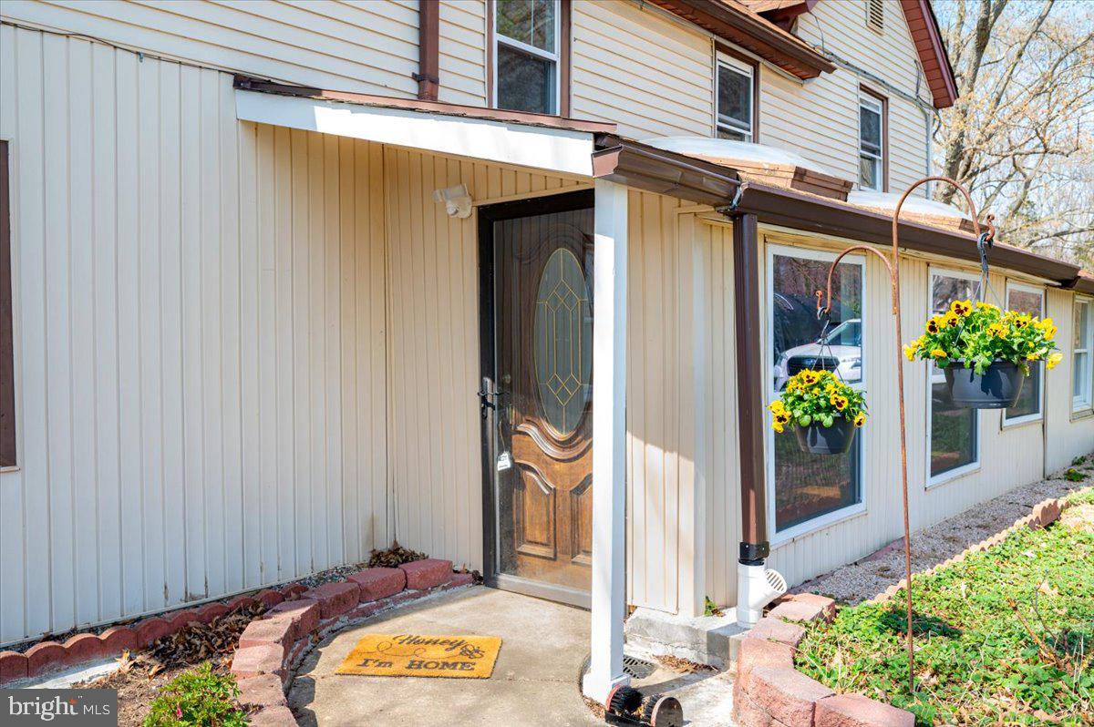 626 Clark Avenue Deale, MD 20751 - Photo 31 of 74 a front view of a house with a porch