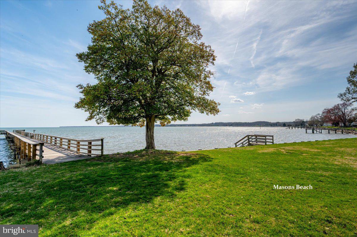 626 Clark Avenue Deale, MD 20751 - Photo 54 of 74 a view of a bench in the garden near a lake