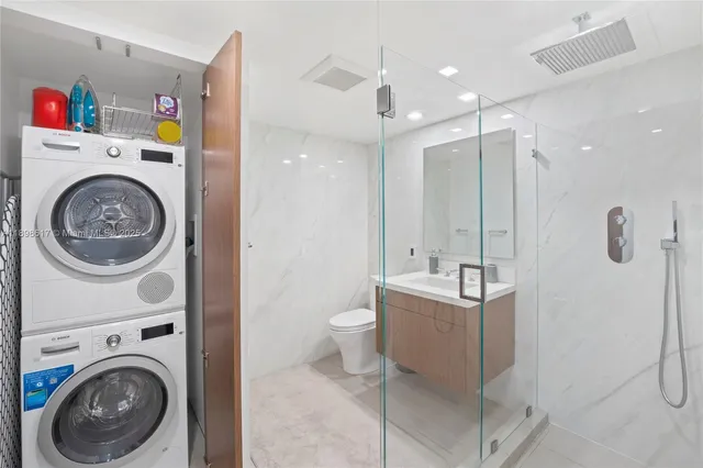 a view of a hallway with washer and dryer