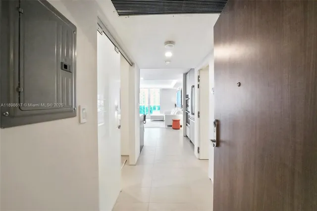 a view of hallway with wooden floor