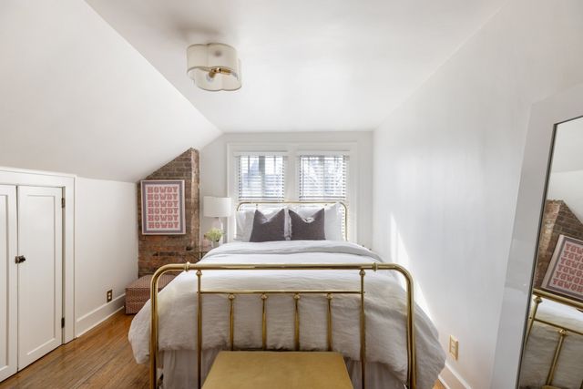 a bathroom with a sink toilet and window