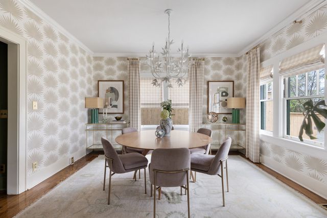 a view of a dining room with furniture and window