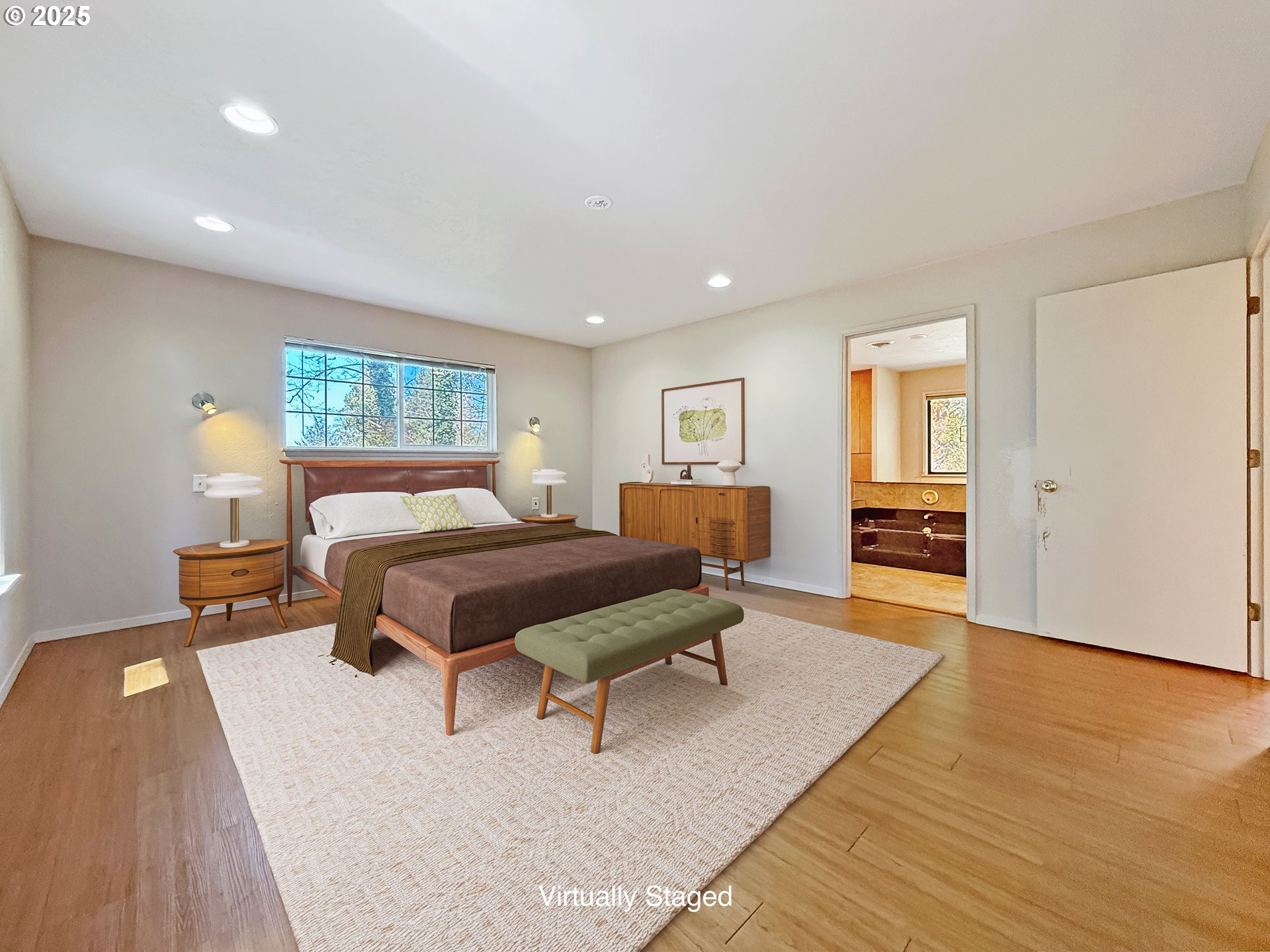 96741 Duley Creek Road Brookings, OR 97415 - Photo 11 of 36 a spacious bedroom with a bed a table and chair