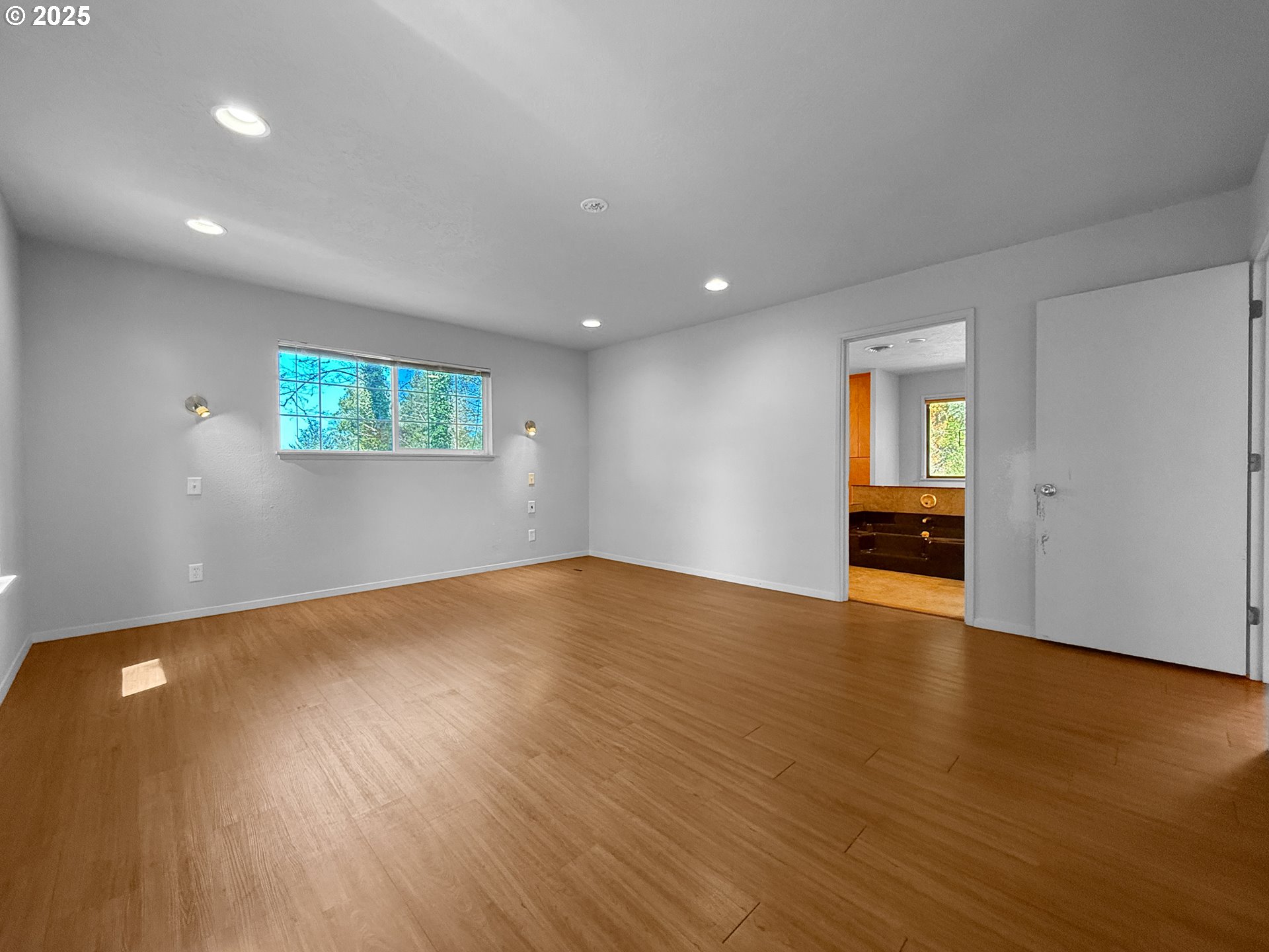 96741 Duley Creek Road Brookings, OR 97415 - Photo 13 of 36 an empty room with wooden floor and windows