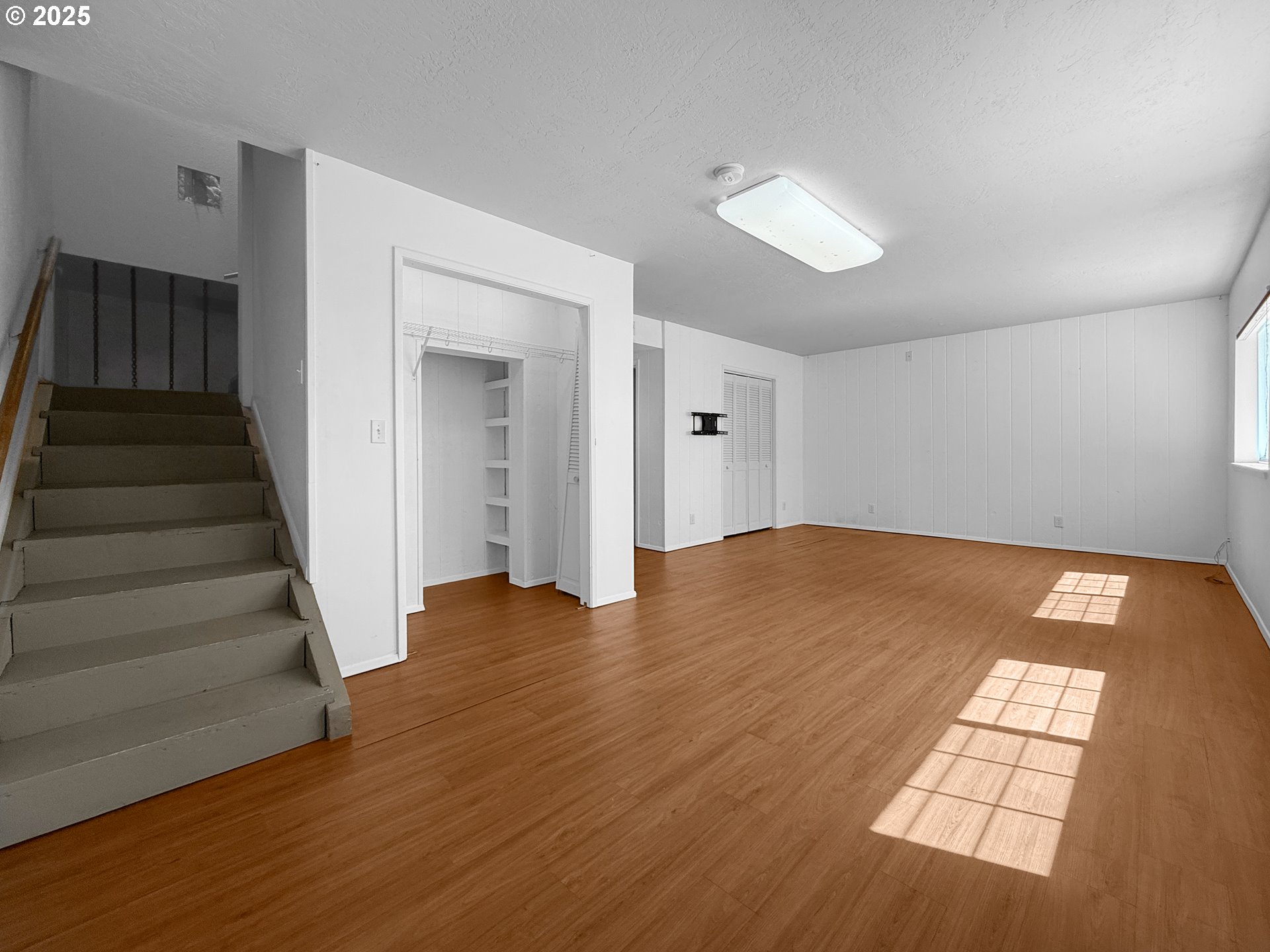 96741 Duley Creek Road Brookings, OR 97415 - Photo 19 of 36 an empty room with wooden floor and entryway