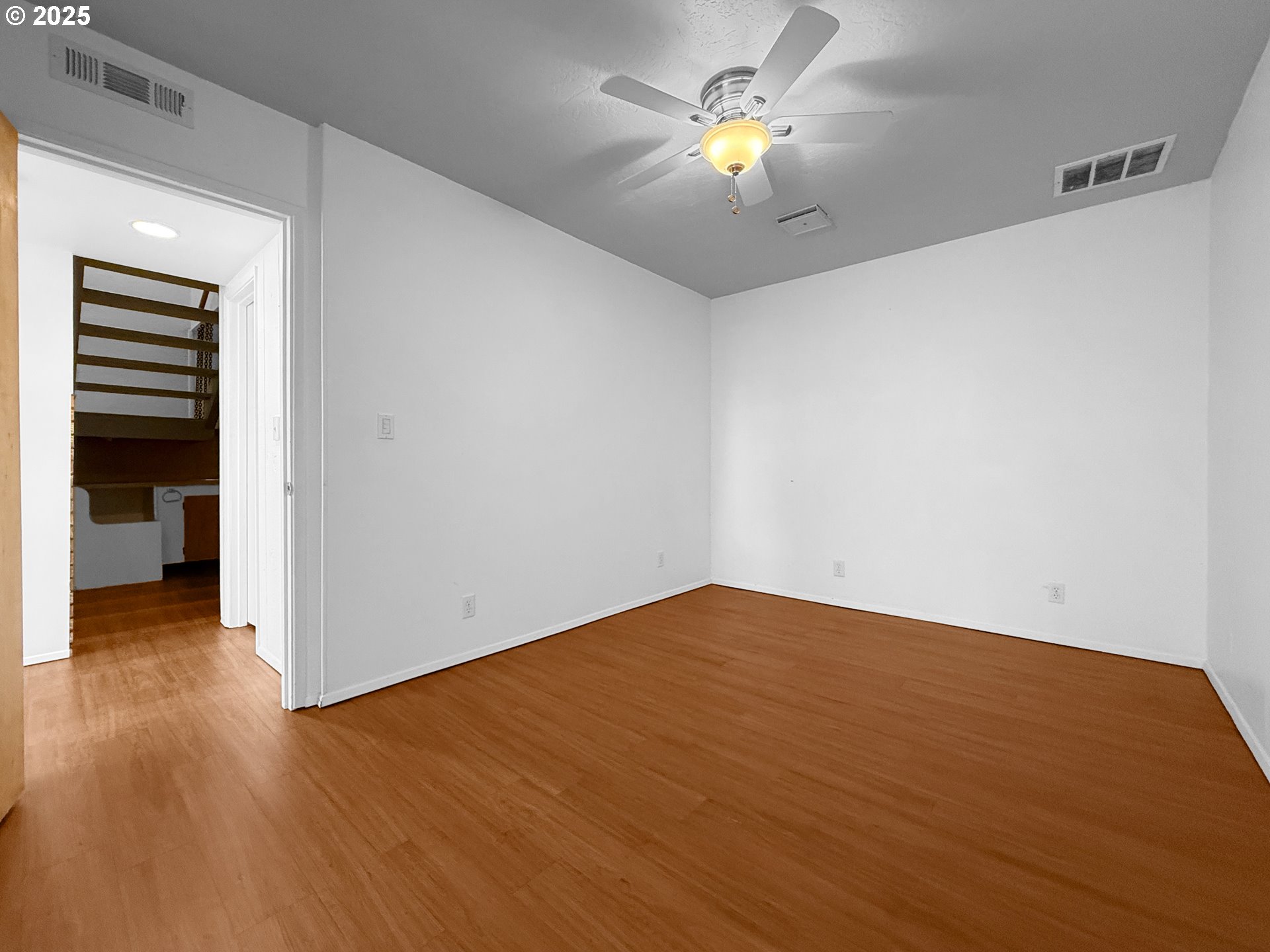 96741 Duley Creek Road Brookings, OR 97415 - Photo 25 of 36 a view of an empty room with a window and wooden floor