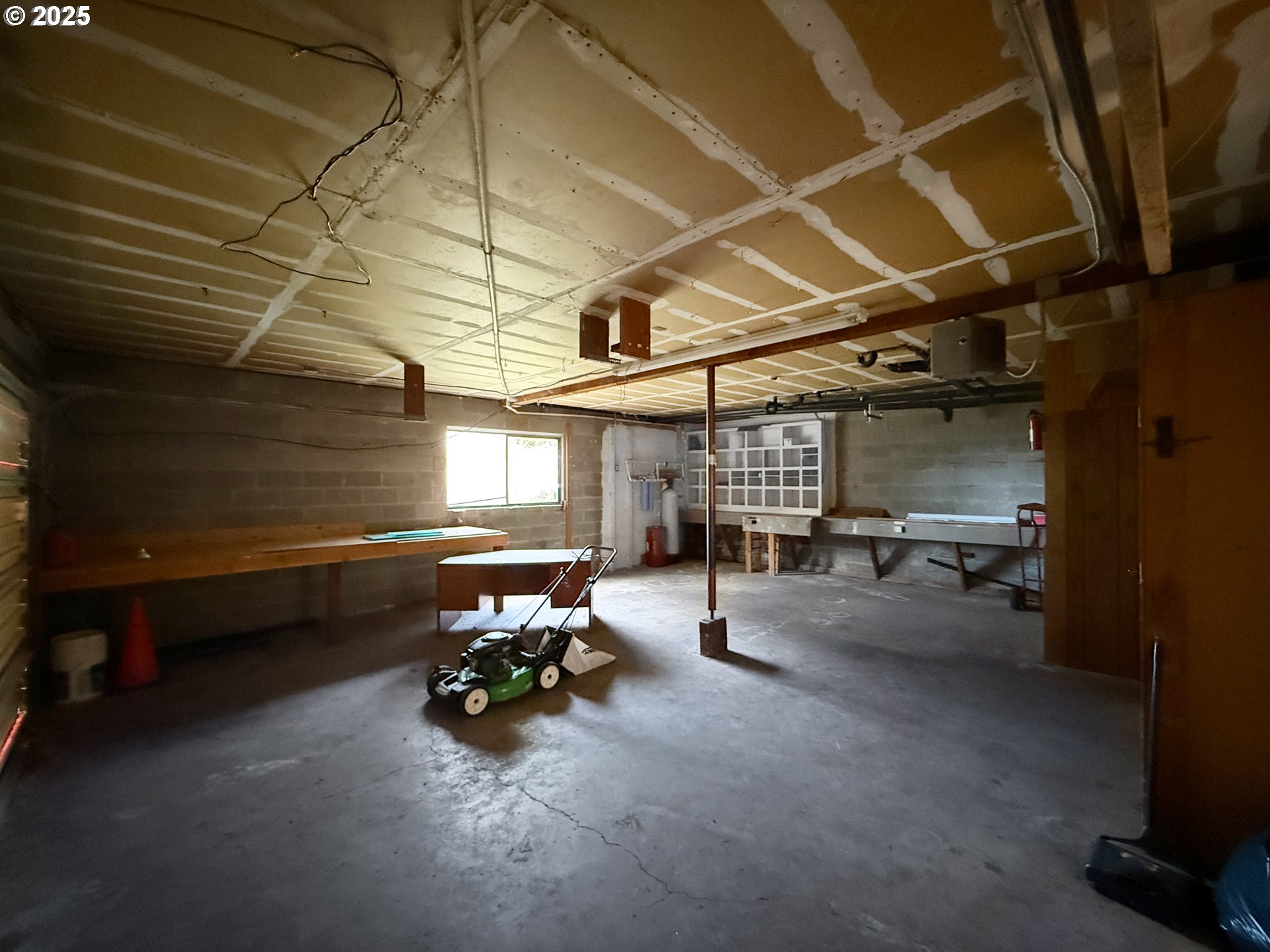 96741 Duley Creek Road Brookings, OR 97415 - Photo 28 of 36 a view of a garage with a white car