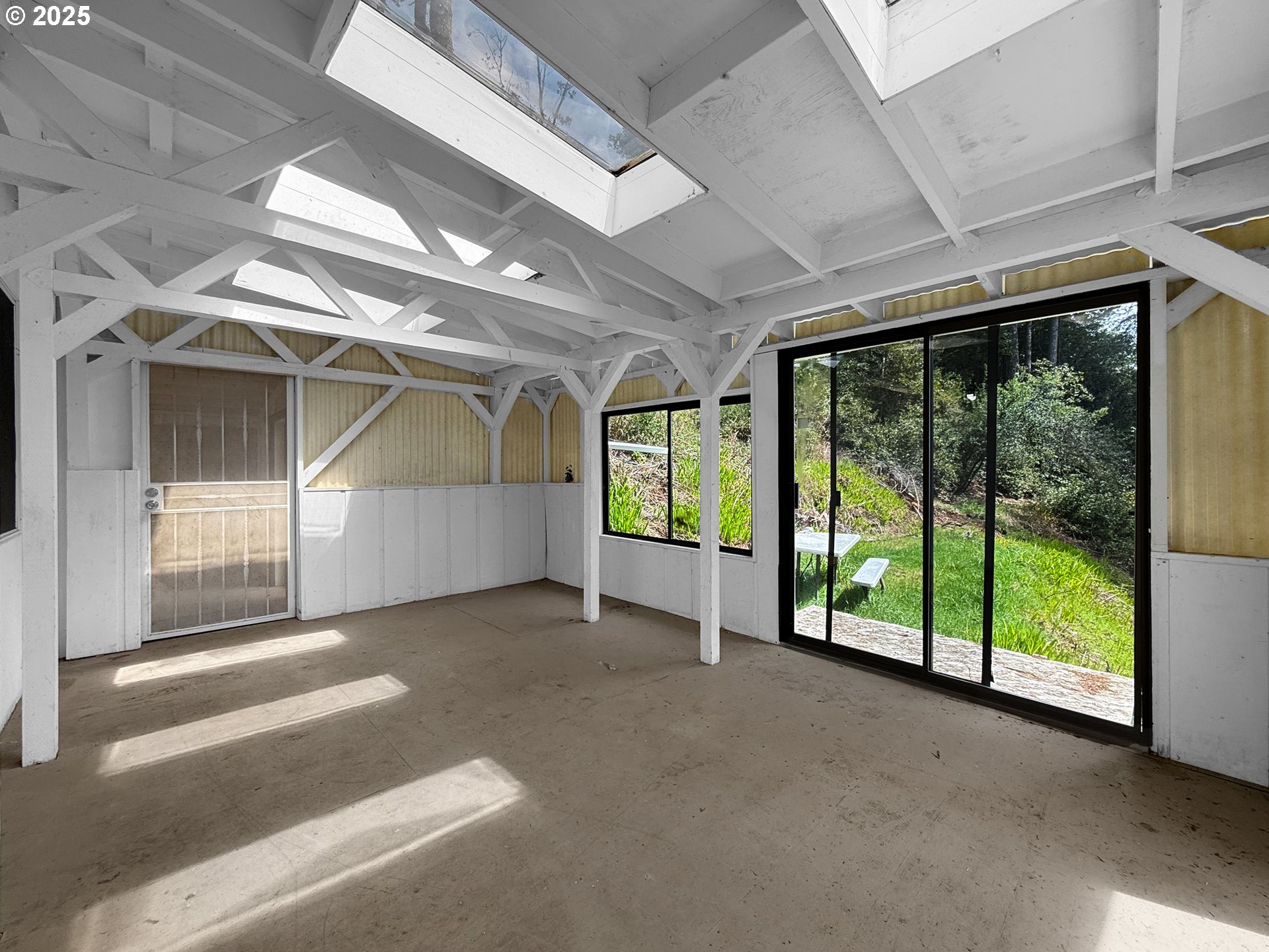 96741 Duley Creek Road Brookings, OR 97415 - Photo 31 of 36 a view of an empty room with a balcony