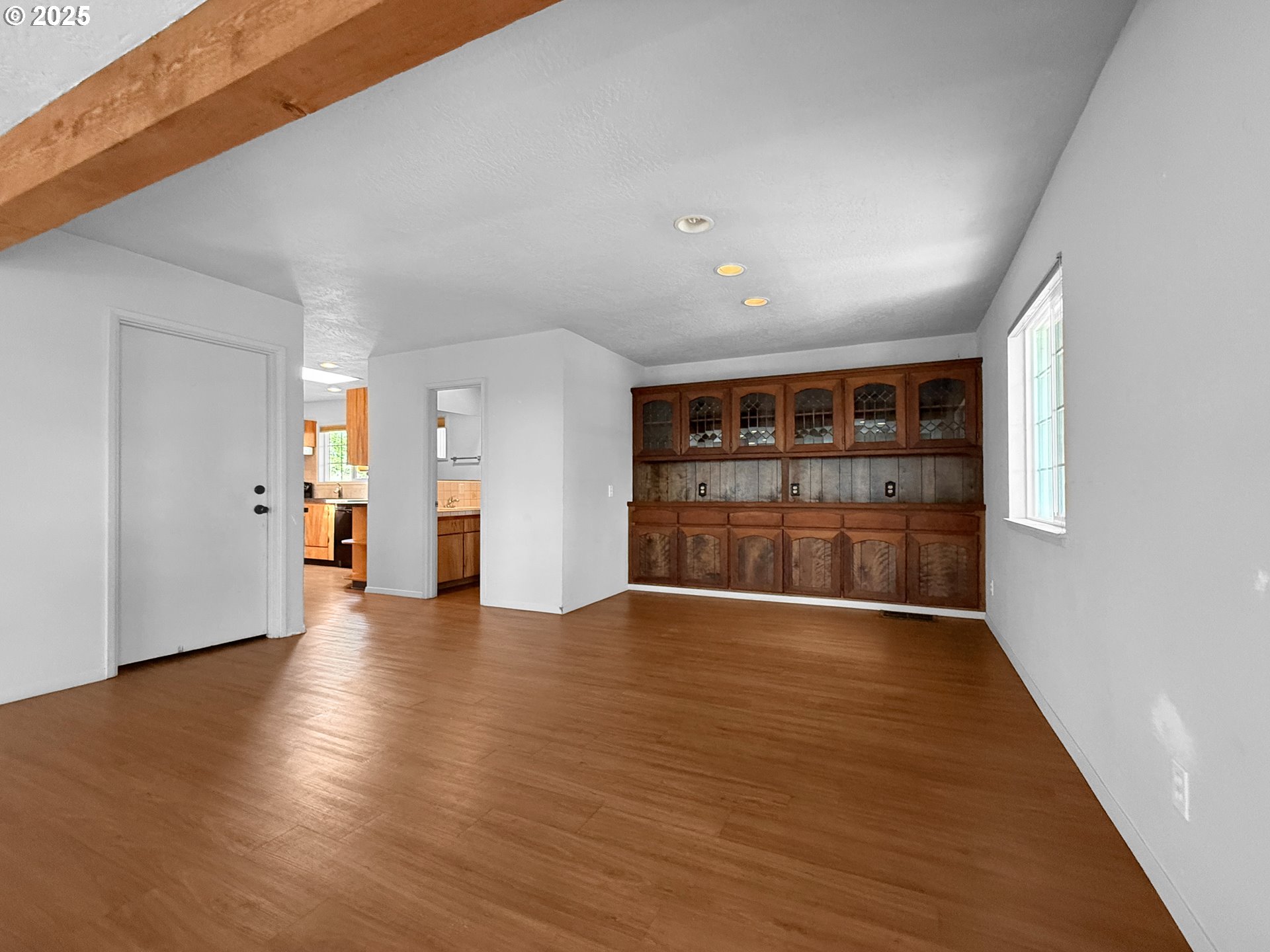 96741 Duley Creek Road Brookings, OR 97415 - Photo 6 of 36 a view of an empty room with wooden floor and a window