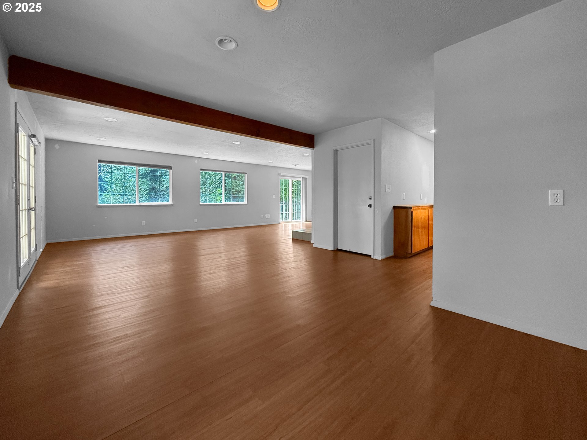96741 Duley Creek Road Brookings, OR 97415 - Photo 7 of 36 a view of an empty room with wooden floor and a window