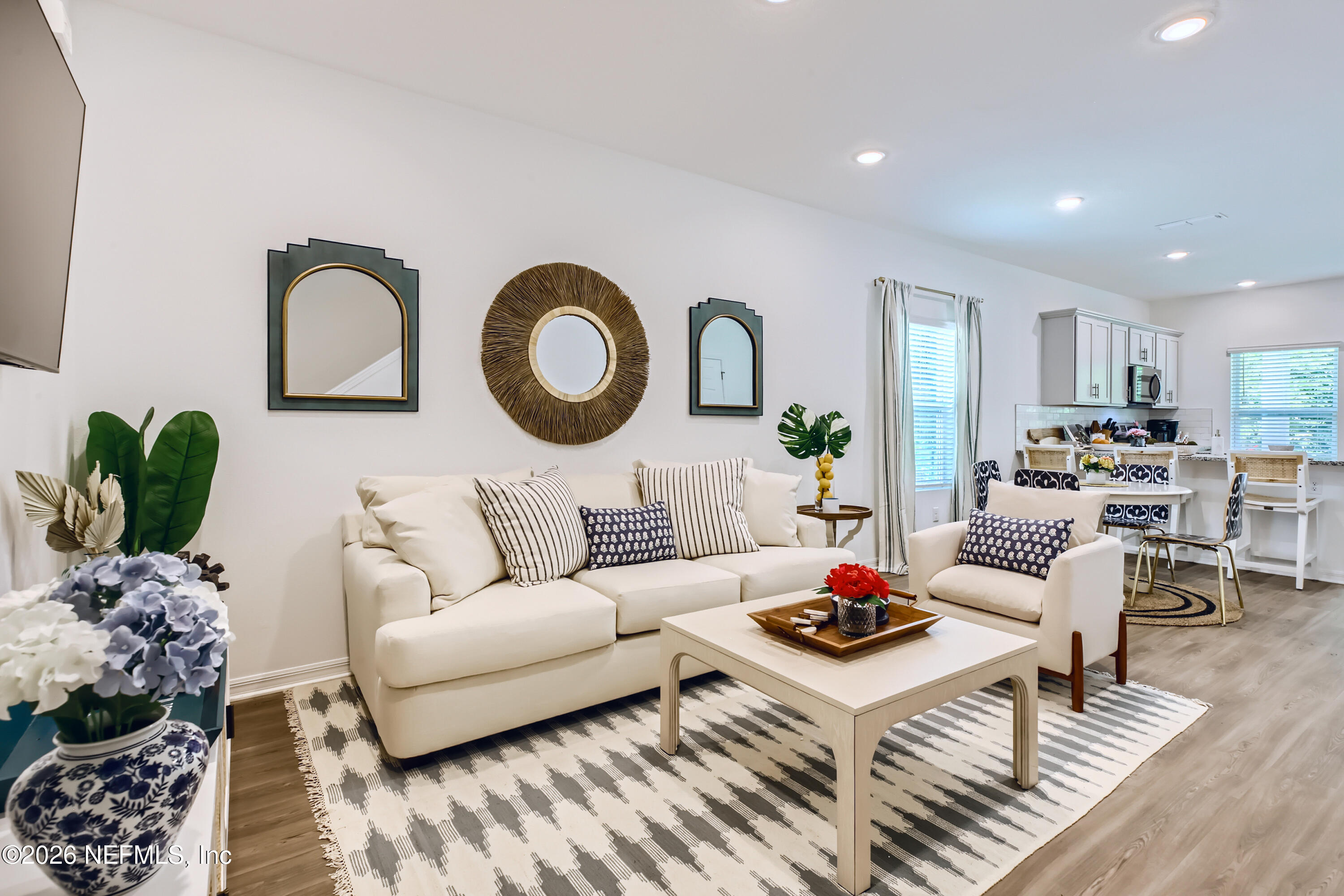 113 Palma Drive St. Augustine, FL 32086 - Photo 5 of 16 a living room with furniture a rug and a potted plant