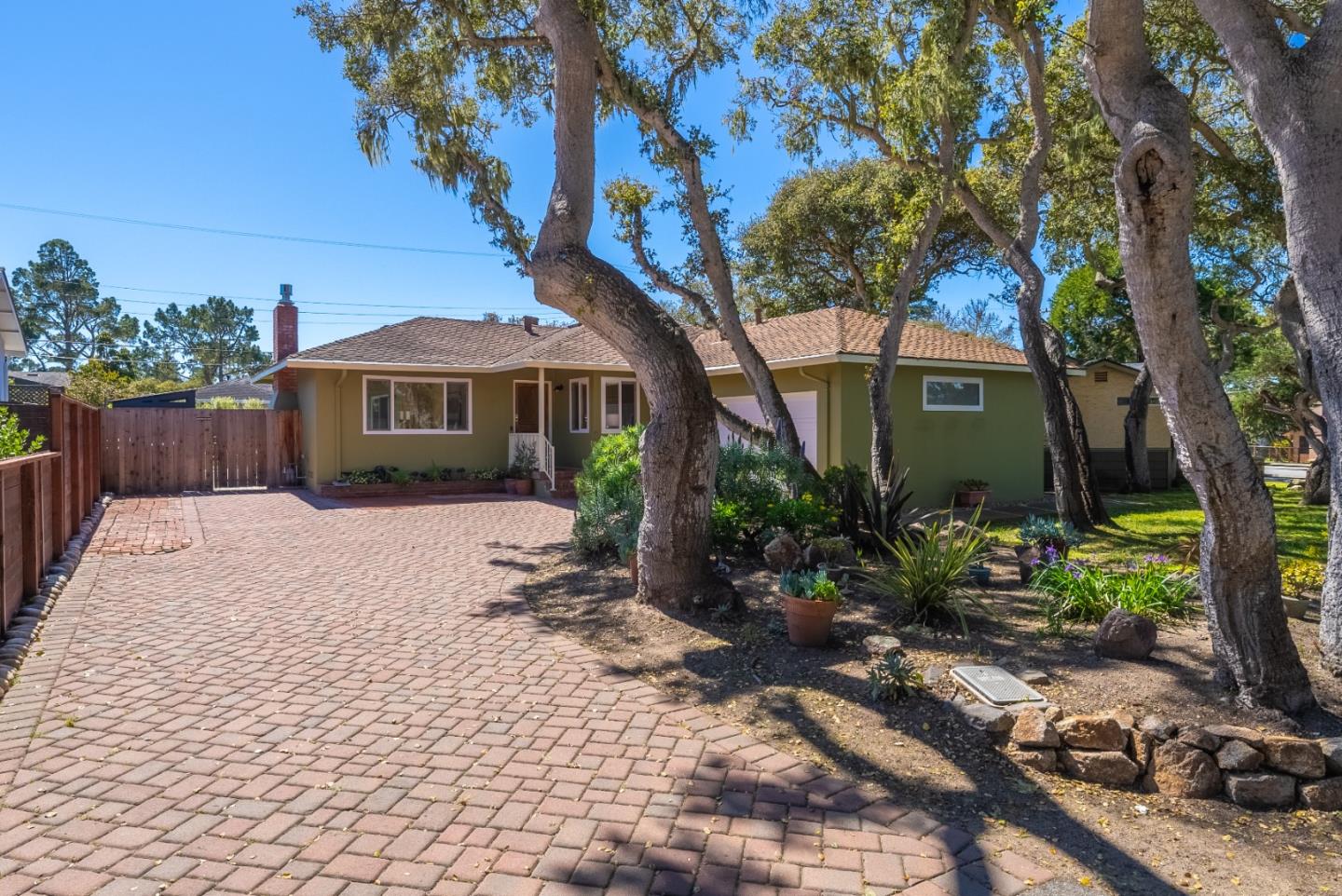 743 Marino Pines Road Pacific Grove, CA 93950 - Photo 1 of 55 a house with trees in the background