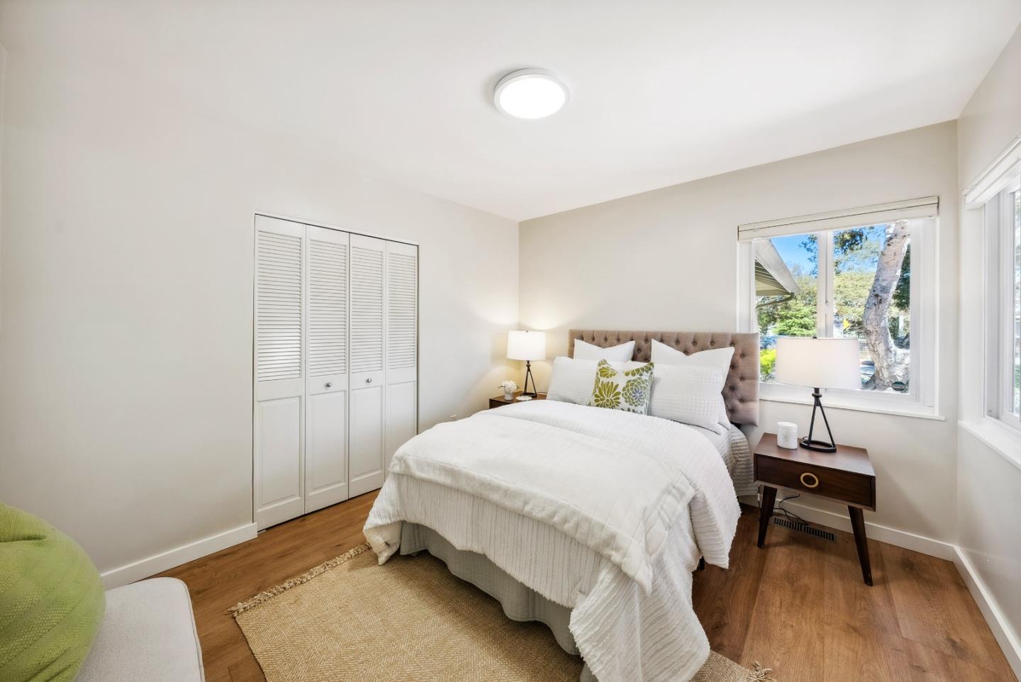743 Marino Pines Road Pacific Grove, CA 93950 - Photo 11 of 55 a bedroom with a bed and a table in it