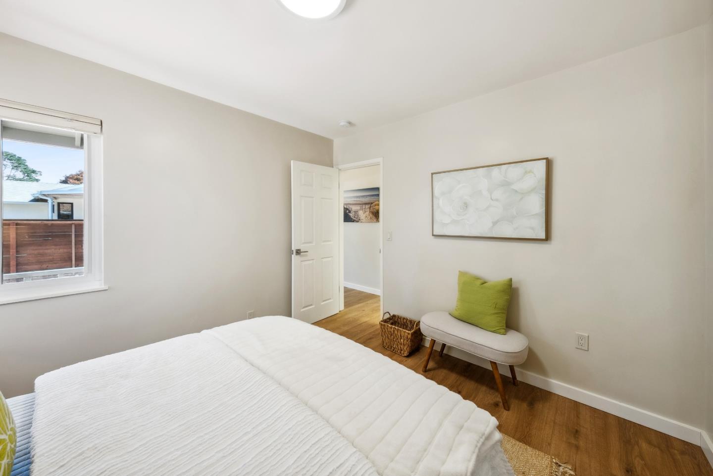 743 Marino Pines Road Pacific Grove, CA 93950 - Photo 12 of 55 a bedroom with a bed and painting on the wall