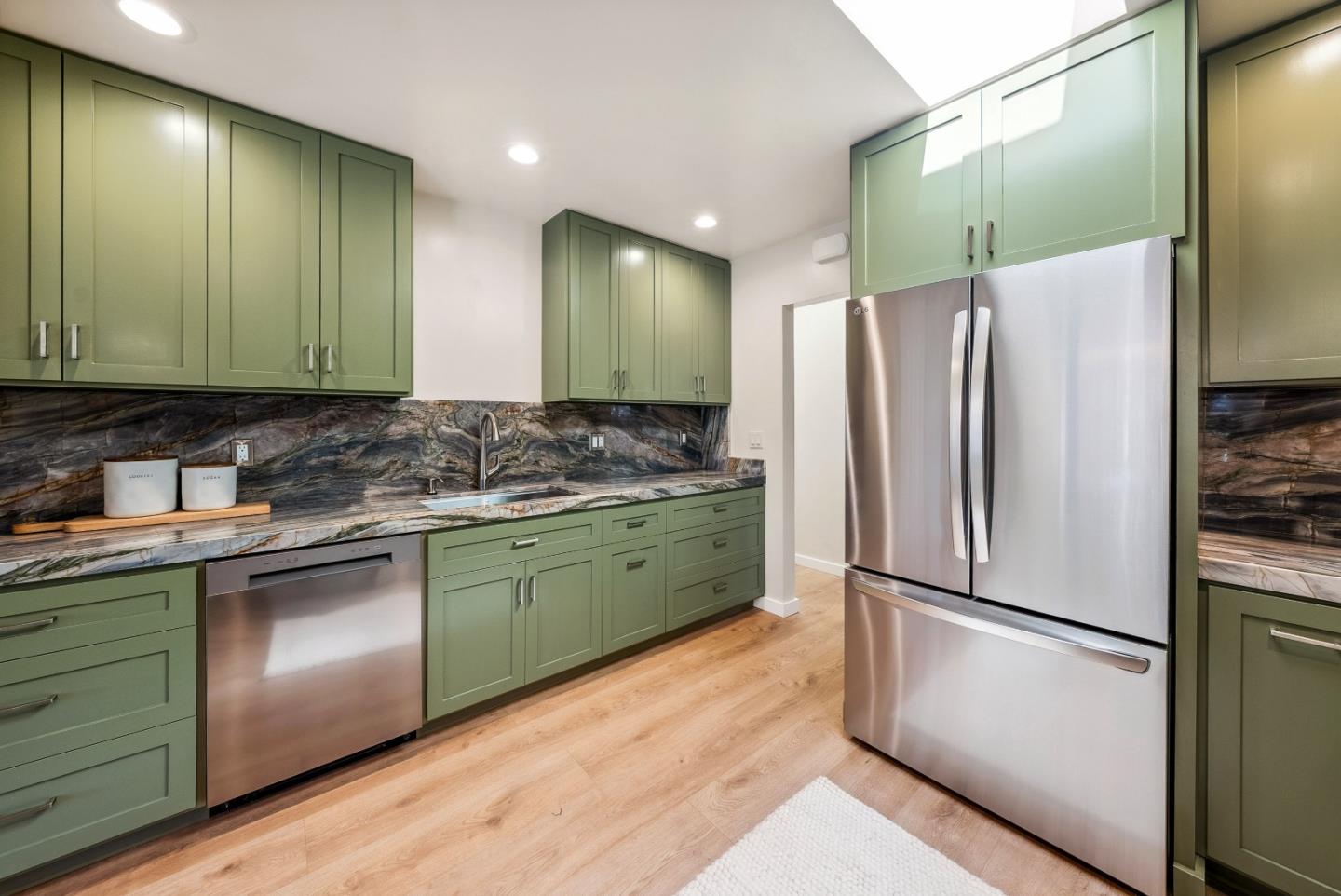 743 Marino Pines Road Pacific Grove, CA 93950 - Photo 17 of 55 a kitchen with stainless steel appliances granite countertop a refrigerator and a sink