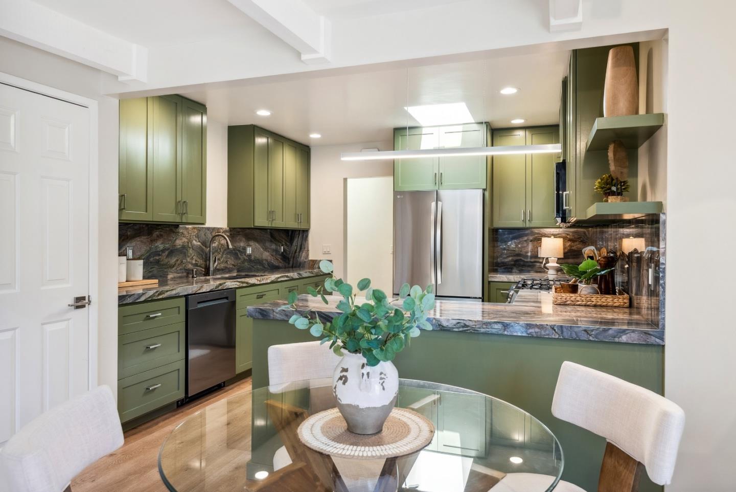 743 Marino Pines Road Pacific Grove, CA 93950 - Photo 23 of 55 a kitchen with a table and chairs