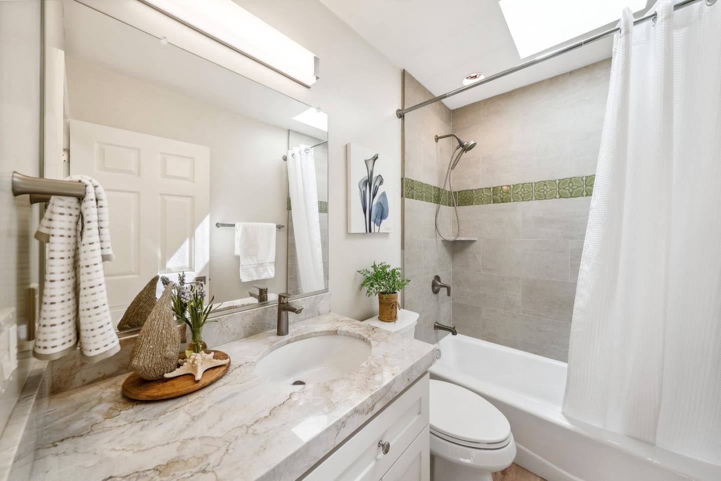 743 Marino Pines Road Pacific Grove, CA 93950 - Photo 24 of 55 a bathroom with a granite countertop sink a toilet and shower