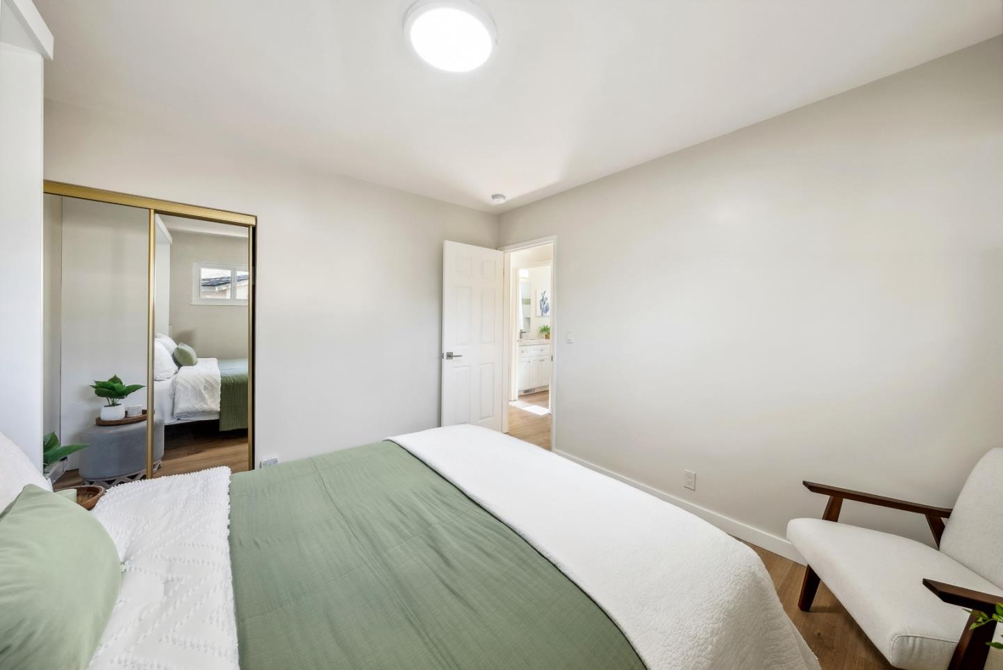 743 Marino Pines Road Pacific Grove, CA 93950 - Photo 26 of 55 a bedroom with a bed and view of chair