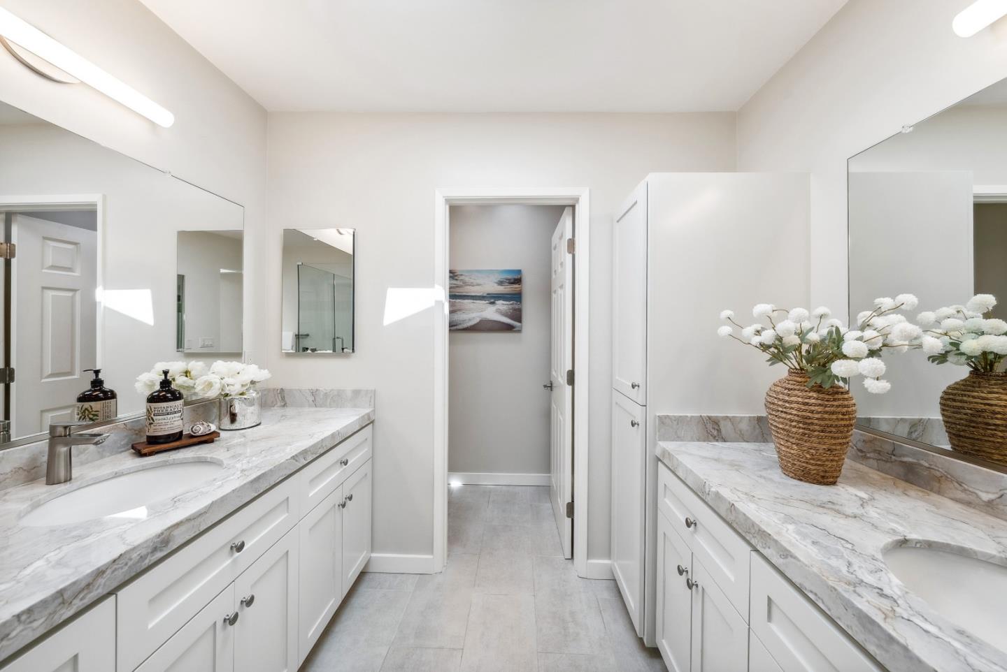 743 Marino Pines Road Pacific Grove, CA 93950 - Photo 29 of 55 a spacious bathroom with a granite countertop sink and a mirror