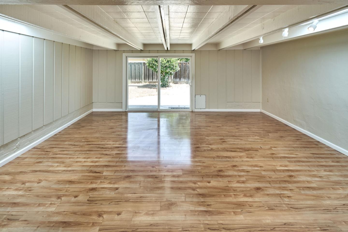 4841 Borina Drive San Jose, CA 95129 - Photo 12 of 26 a view of empty room with wooden floor and fan