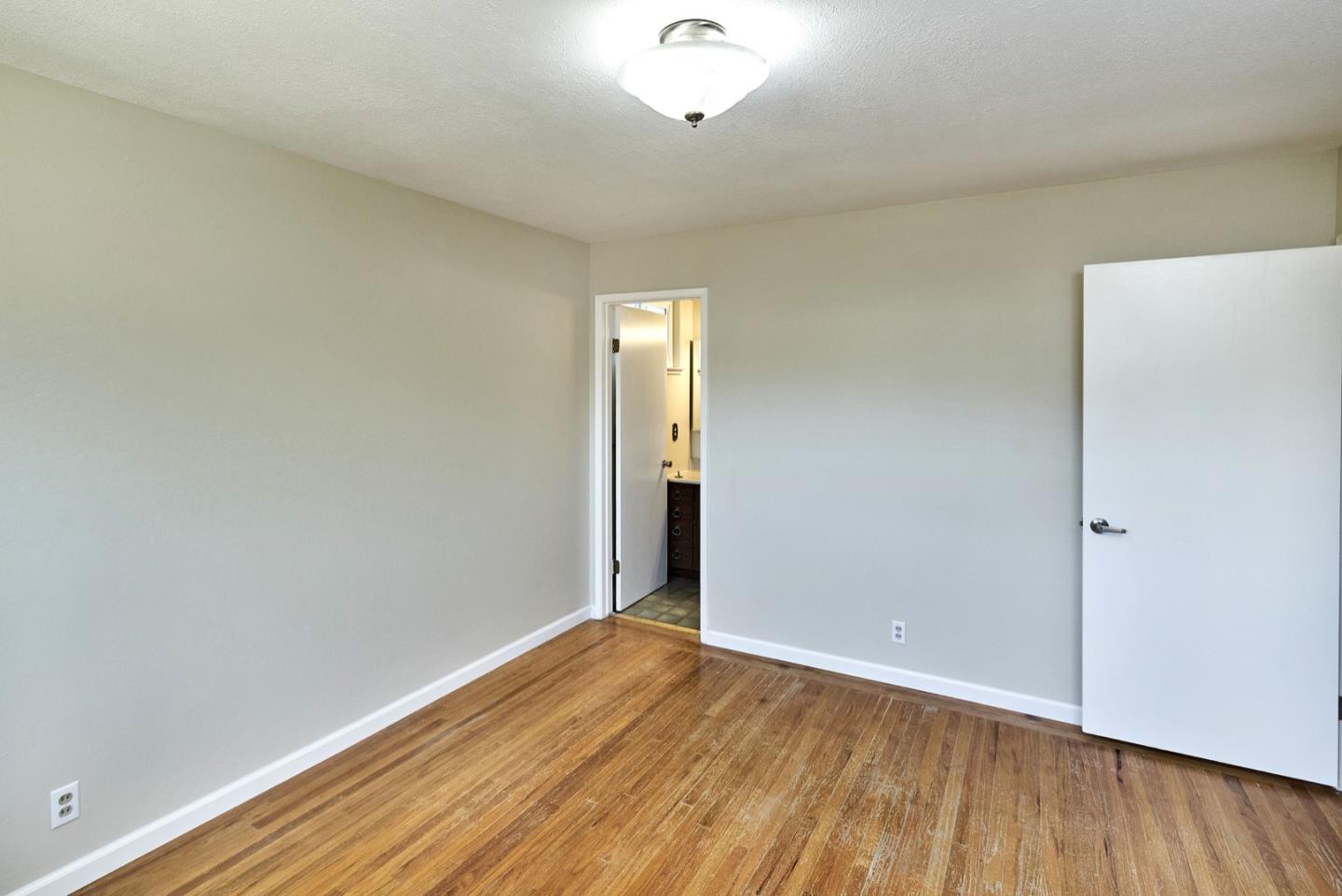 4841 Borina Drive San Jose, CA 95129 - Photo 19 of 26 an empty room with wooden floor and windows