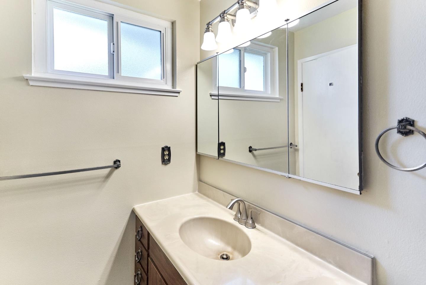 4841 Borina Drive San Jose, CA 95129 - Photo 21 of 26 a bathroom with a sink and a mirror